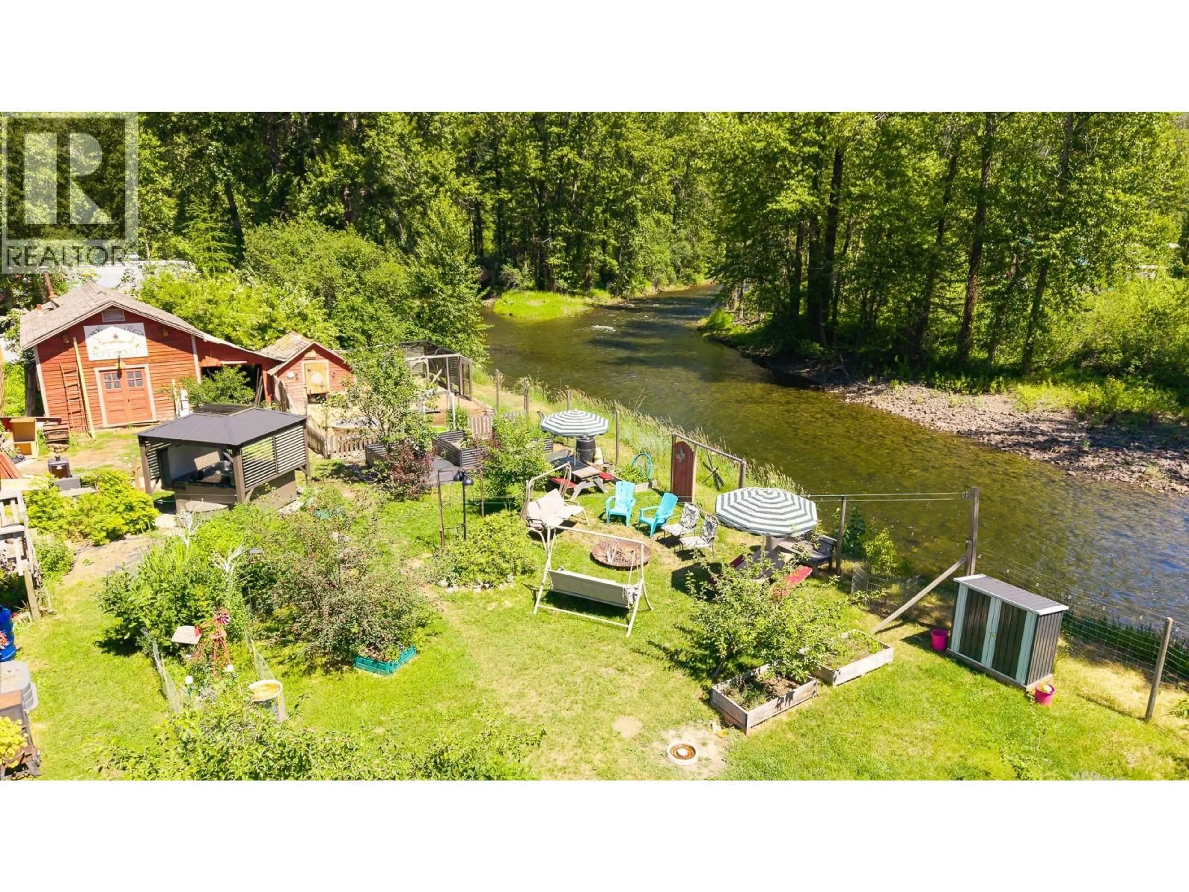 A pic from outside/outdoor area/front of a property/back of a property/a pic from drone, water/lake/river/ocean view for 9005 3 & 95 HIGHWAY, Yahk British Columbia V0B2P0