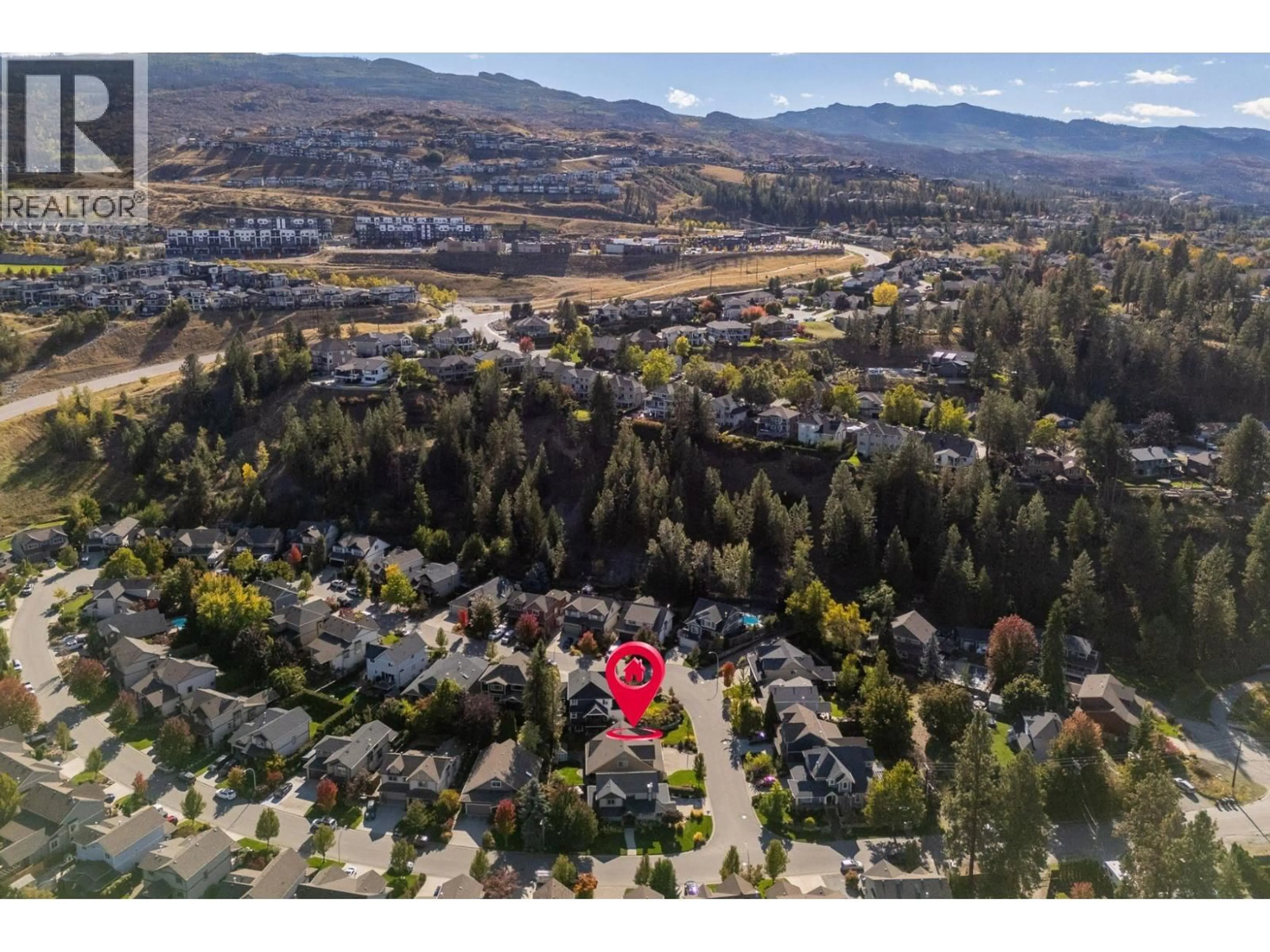 A pic from outside/outdoor area/front of a property/back of a property/a pic from drone, mountain view for 905 PARET CRESCENT, Kelowna British Columbia V1W4X8