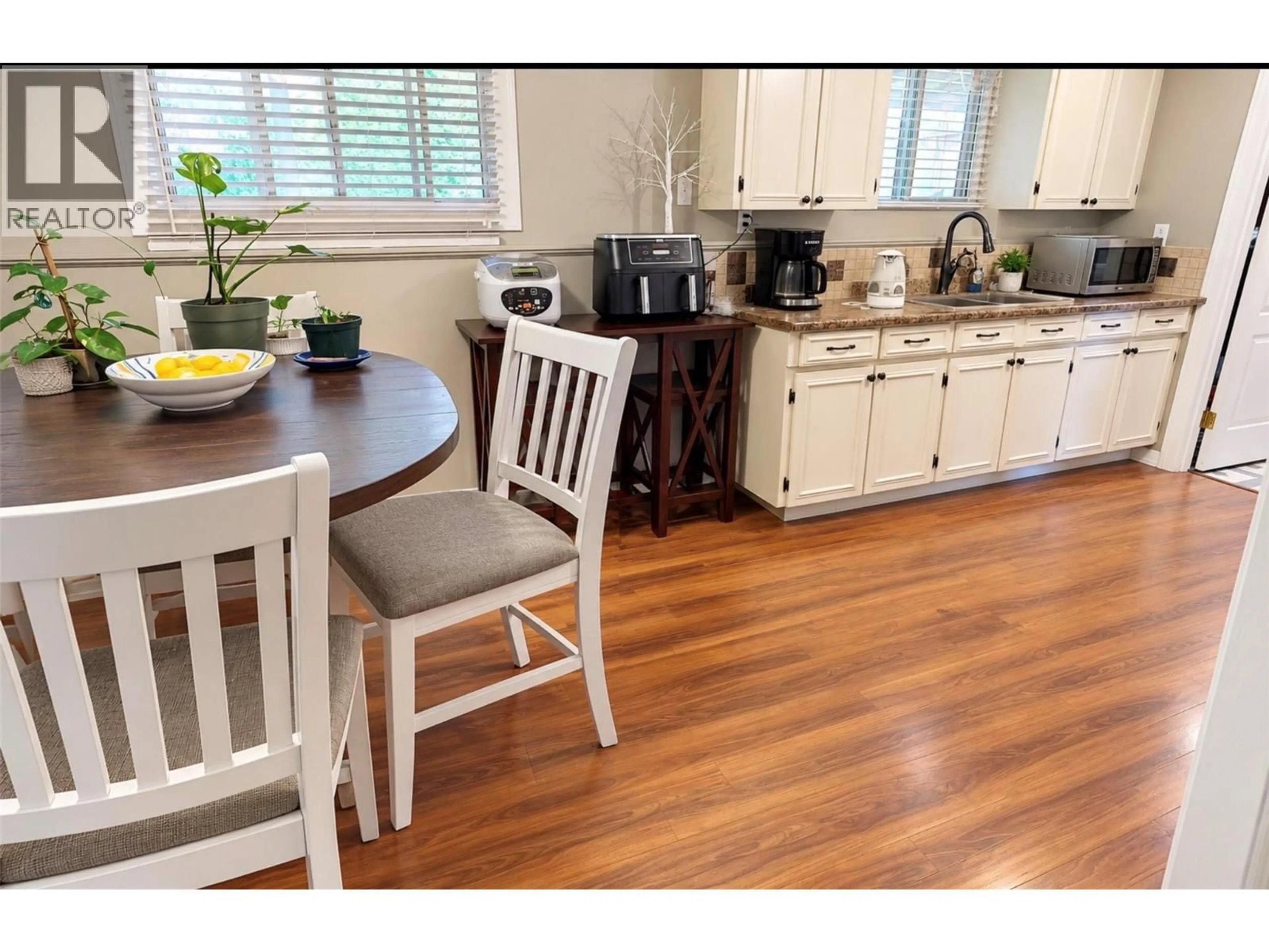 Open concept kitchen, wood/laminate floor for 1355 ALDON ROAD, Kelowna British Columbia V1X5A1