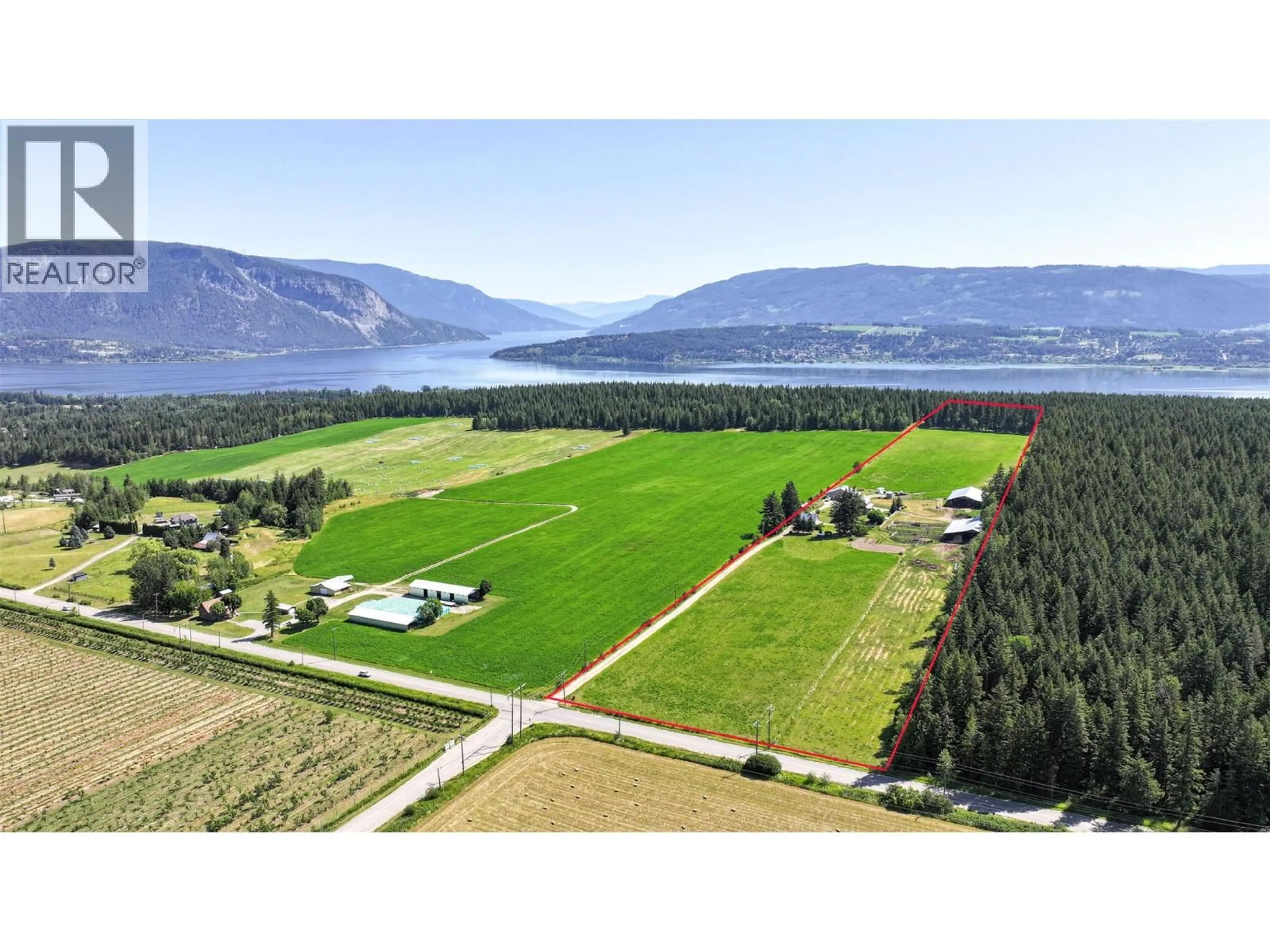A pic from outside/outdoor area/front of a property/back of a property/a pic from drone, water/lake/river/ocean view for 2990 50 STREET NORTHWEST, Salmon Arm British Columbia V1E4M2
