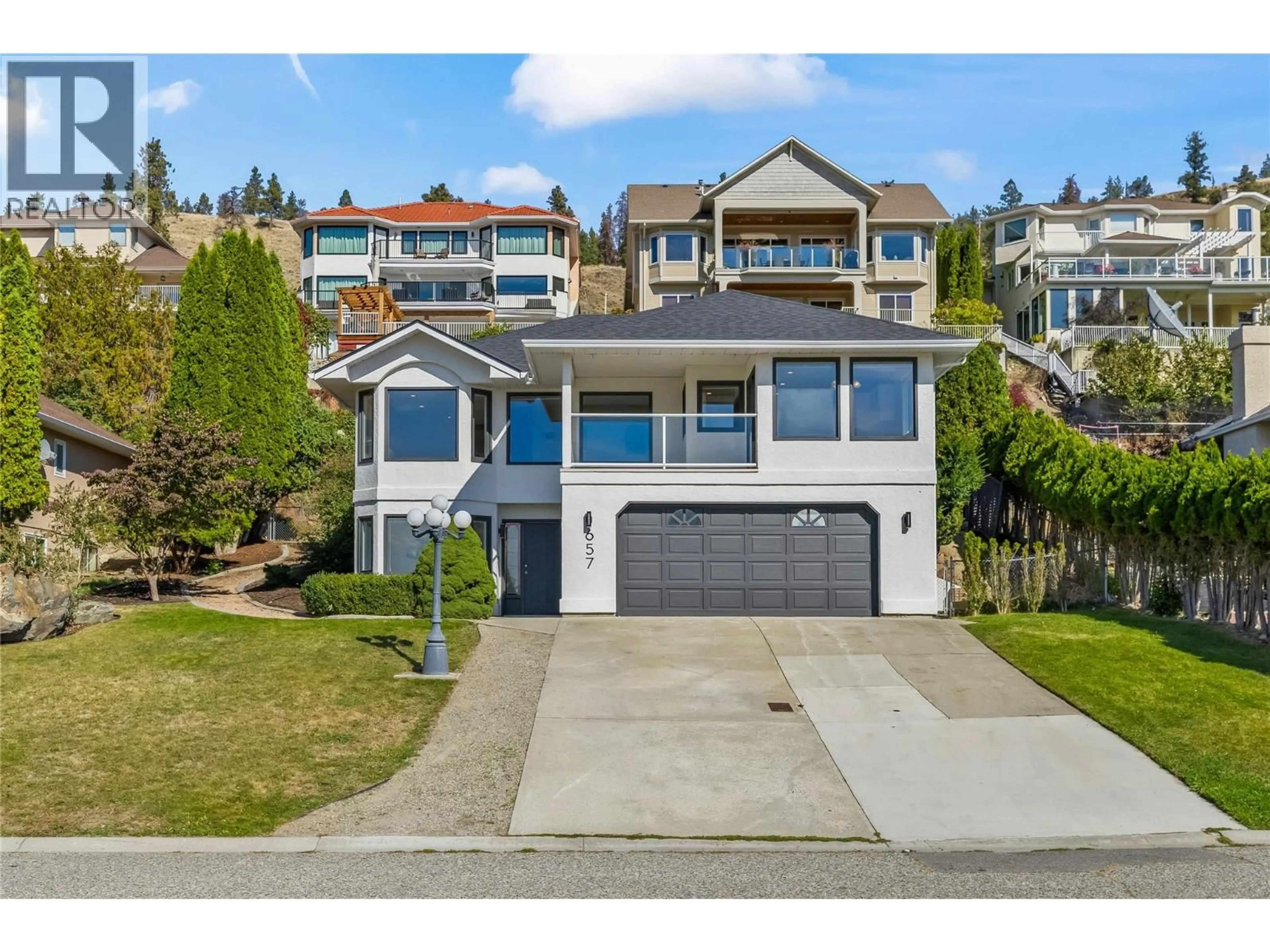 Home with vinyl exterior material, street for 657 ROYAL VIEW DRIVE, Kelowna British Columbia V1Y9K5