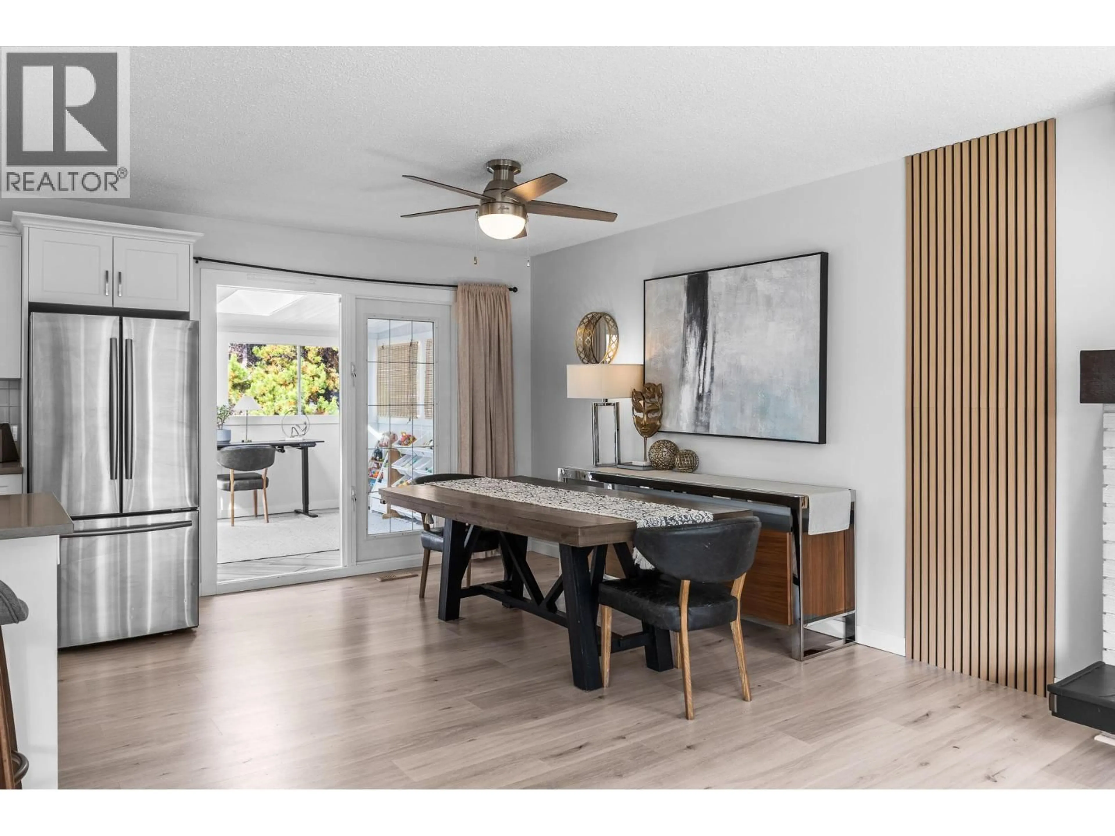 Open concept kitchen, wood/laminate floor for 1866 LARGE AVENUE, Kelowna British Columbia V1P1L5