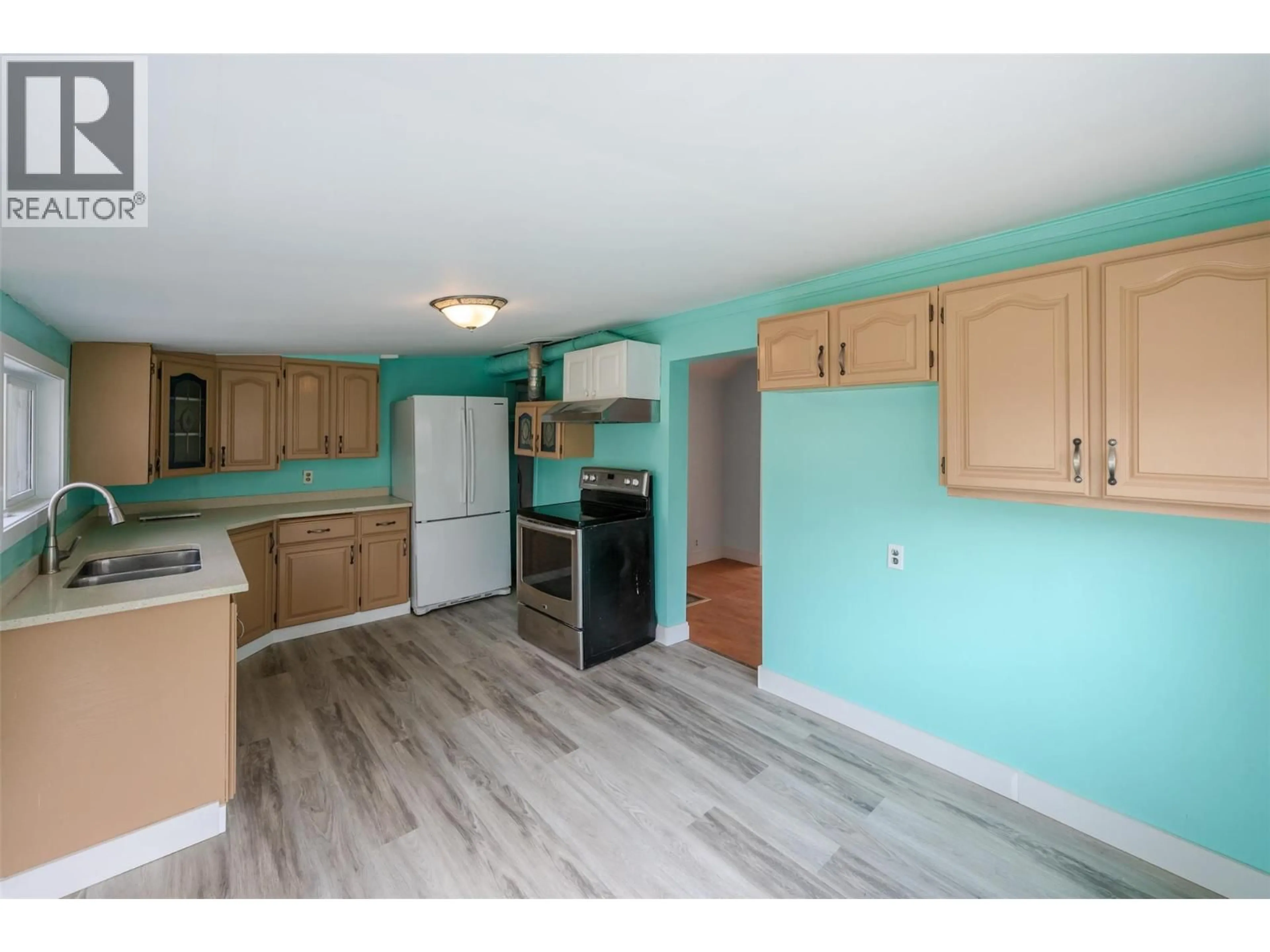 Standard kitchen, wood/laminate floor for 5814 MAIN STREET, Oliver British Columbia V0H1T9