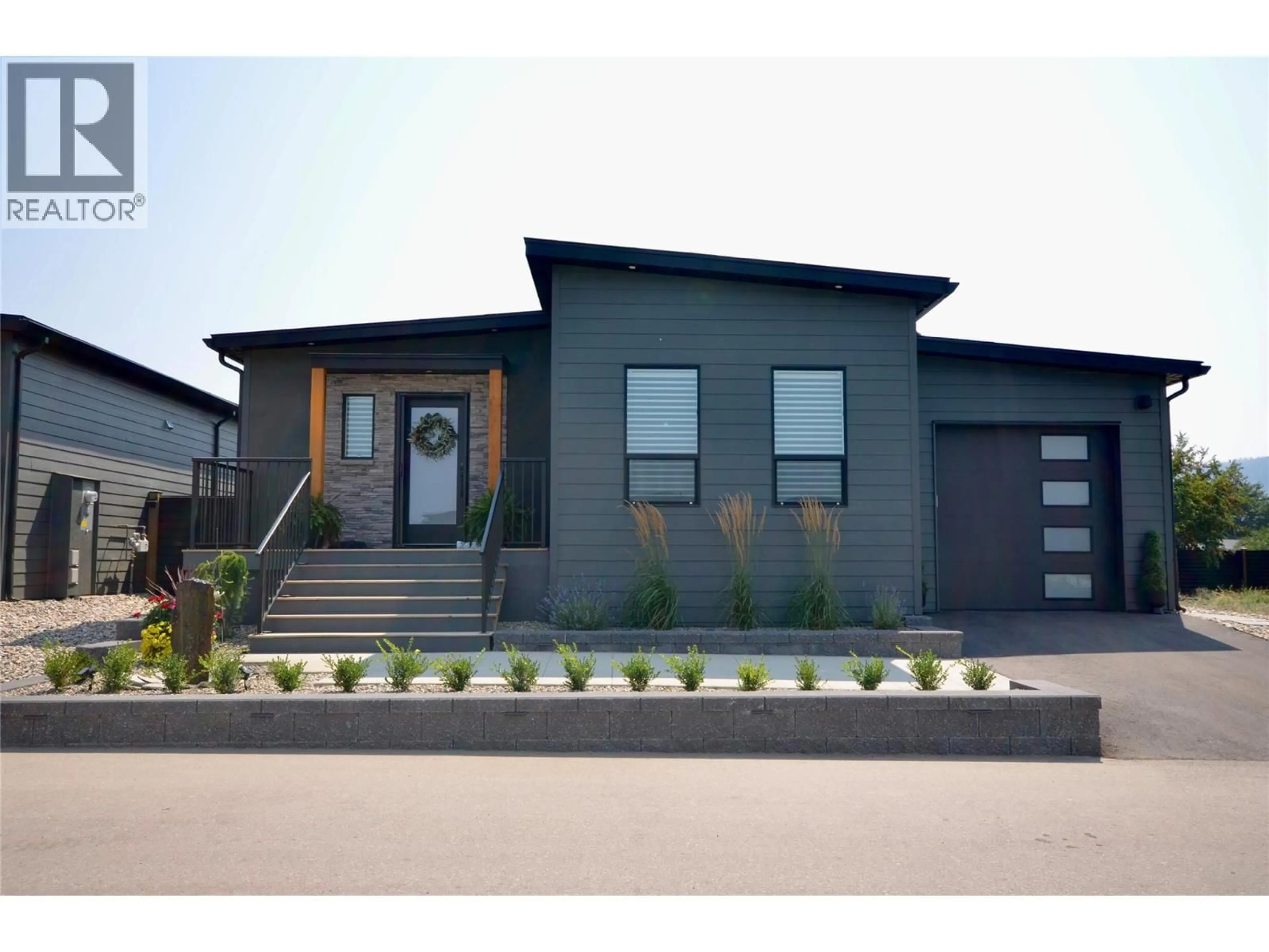Home with brick exterior material, street for 203 - 12204 WESTSIDE ROAD, Vernon British Columbia V1H2A4