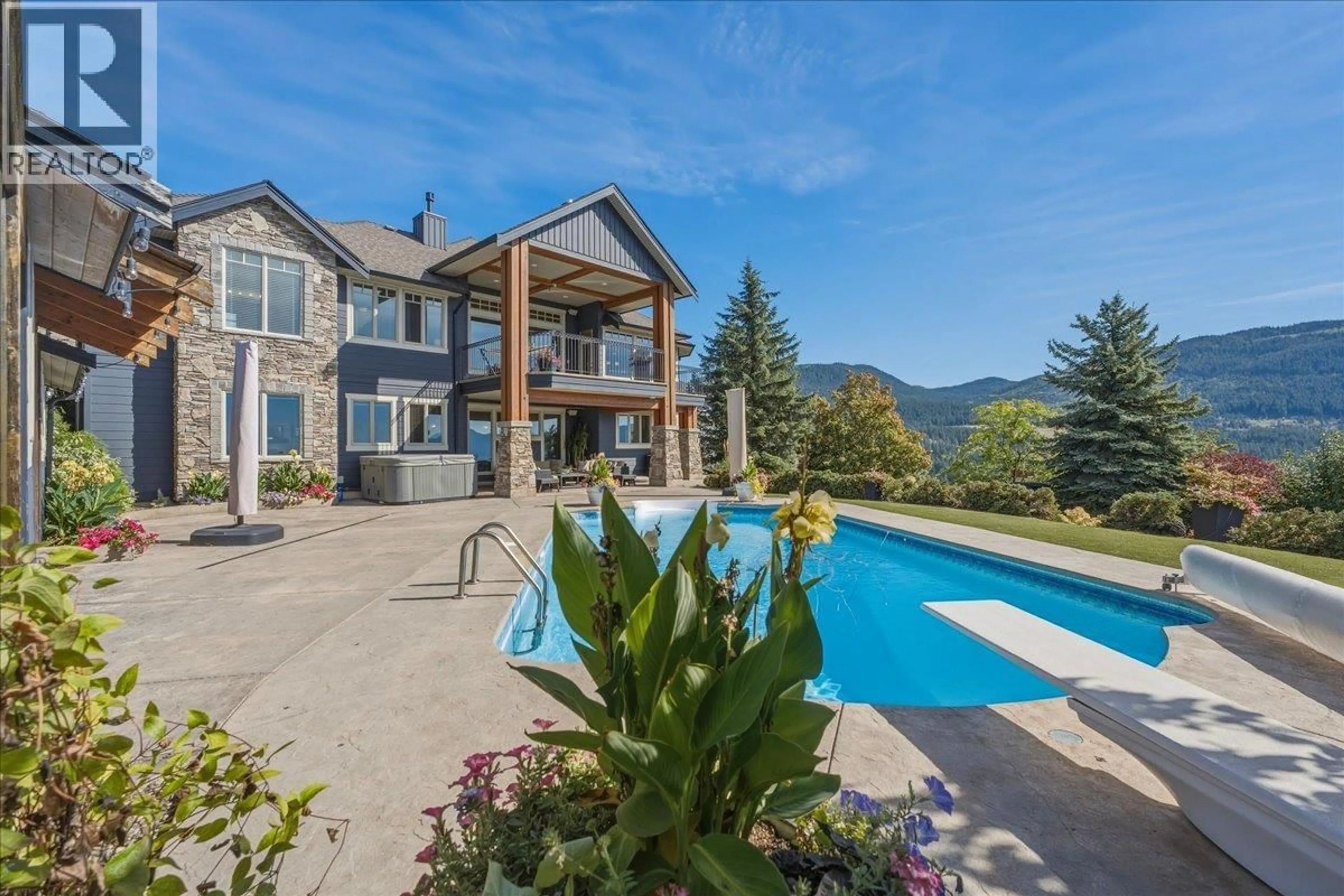 A pic from outside/outdoor area/front of a property/back of a property/a pic from drone, mountain view for 2009 APEX COURT, Vernon British Columbia V1B3Z4
