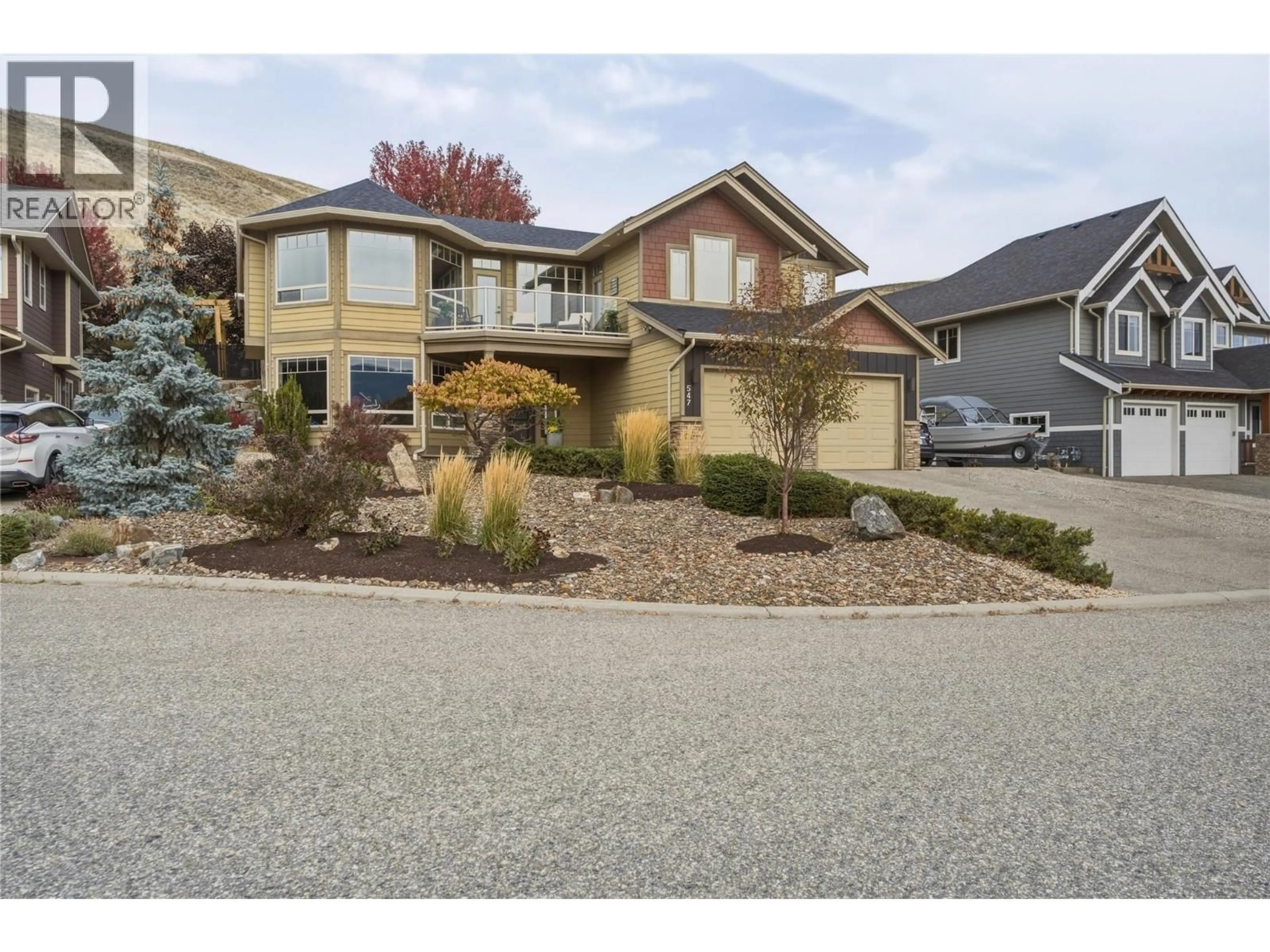 Home with vinyl exterior material, street for 547 MT. TANNER PLACE, Coldstream British Columbia V1B4B4