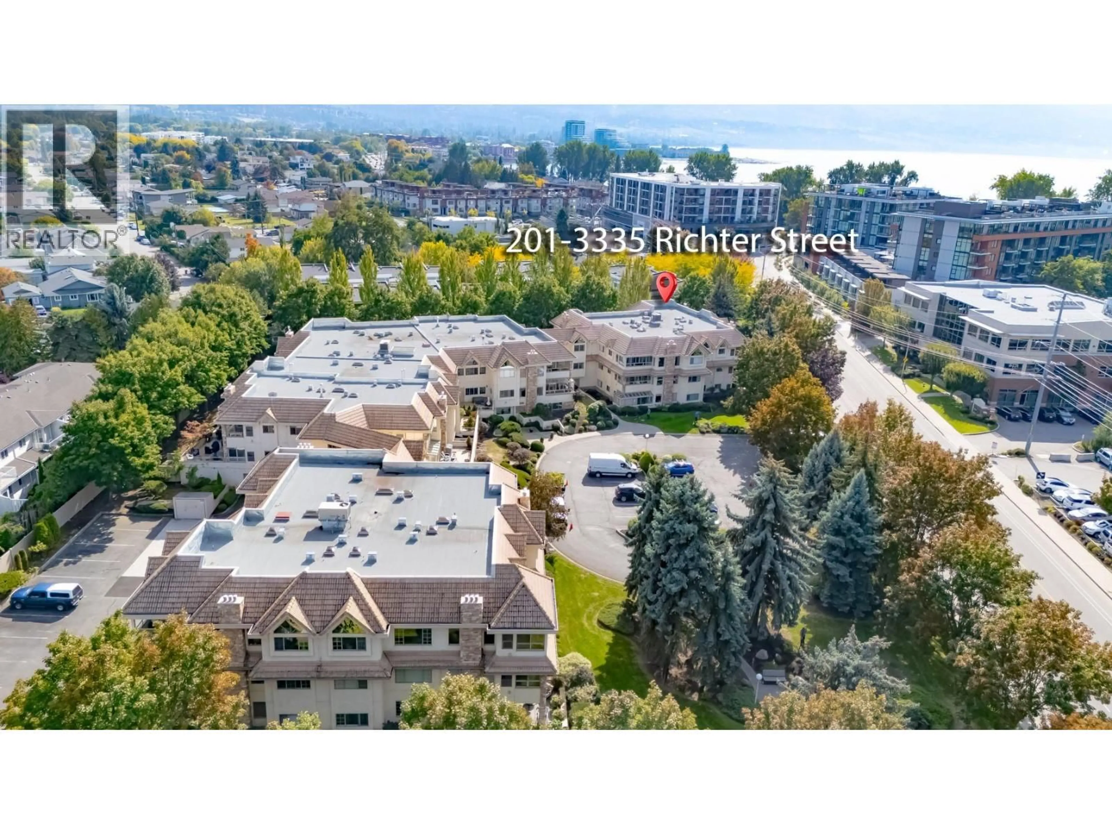 A pic from outside/outdoor area/front of a property/back of a property/a pic from drone, mountain view for 201 - 3335 RICHTER STREET, Kelowna British Columbia V1W3Y1