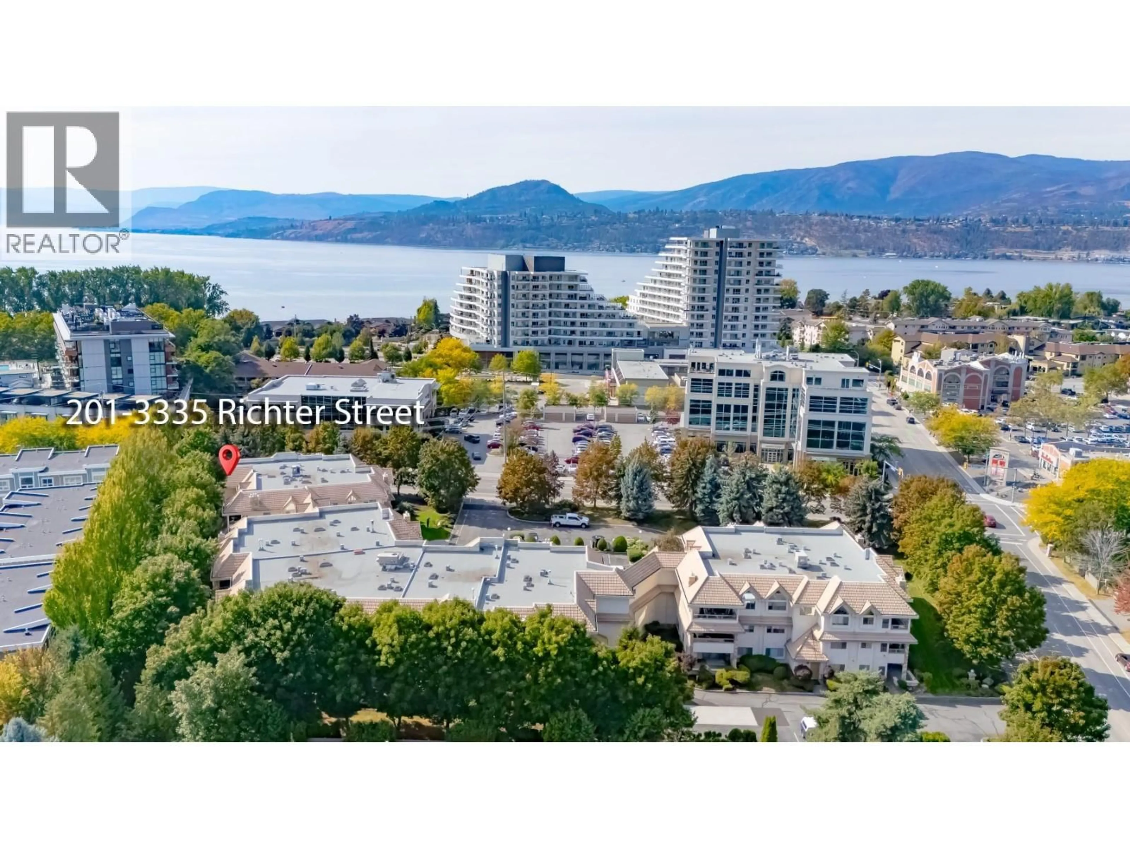 A pic from outside/outdoor area/front of a property/back of a property/a pic from drone, water/lake/river/ocean view for 201 - 3335 RICHTER STREET, Kelowna British Columbia V1W3Y1