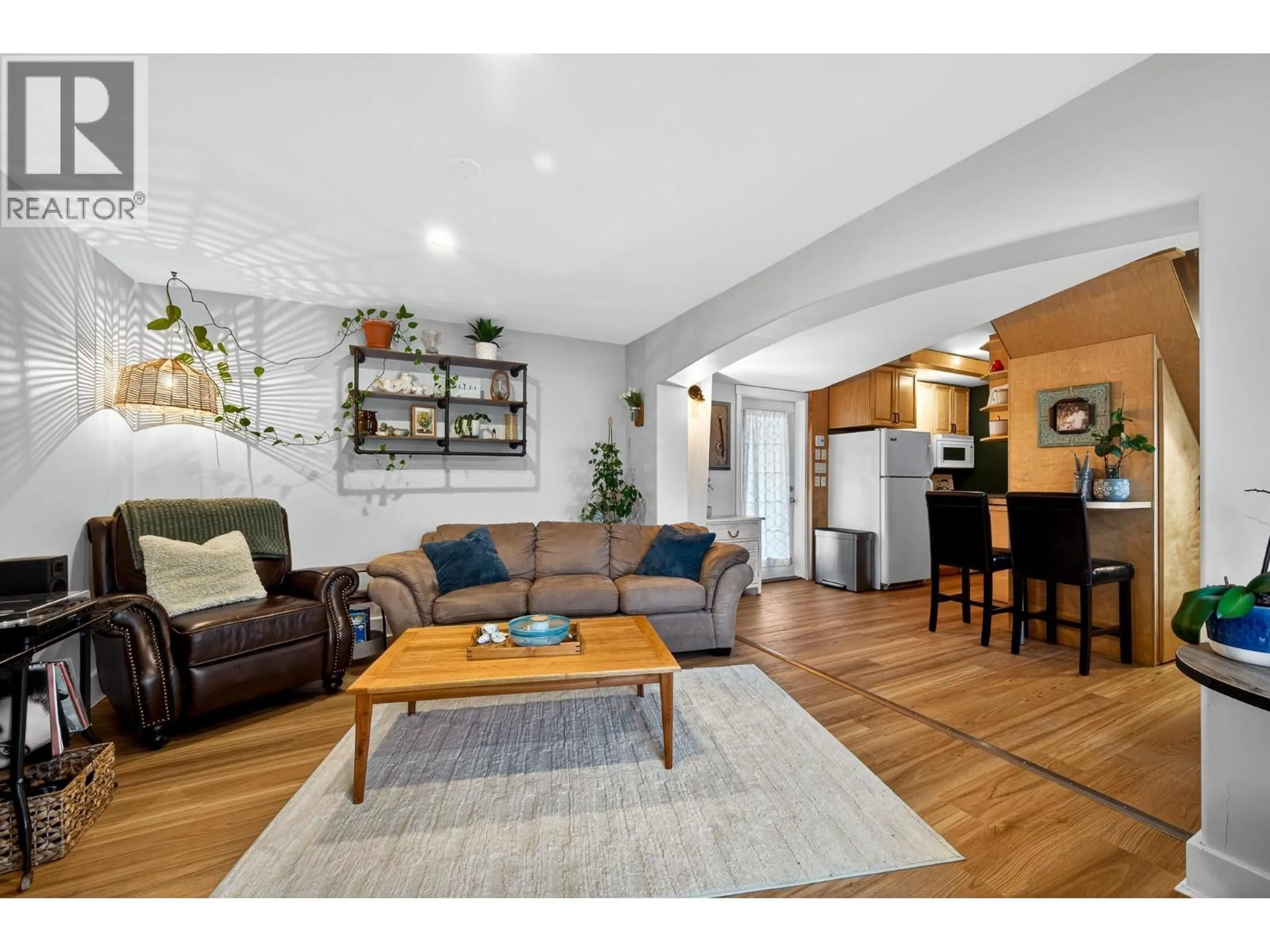 Living room with furniture, wood/laminate floor for 114 - 870 MCQUEEN DRIVE, Kamloops British Columbia V2B7X9