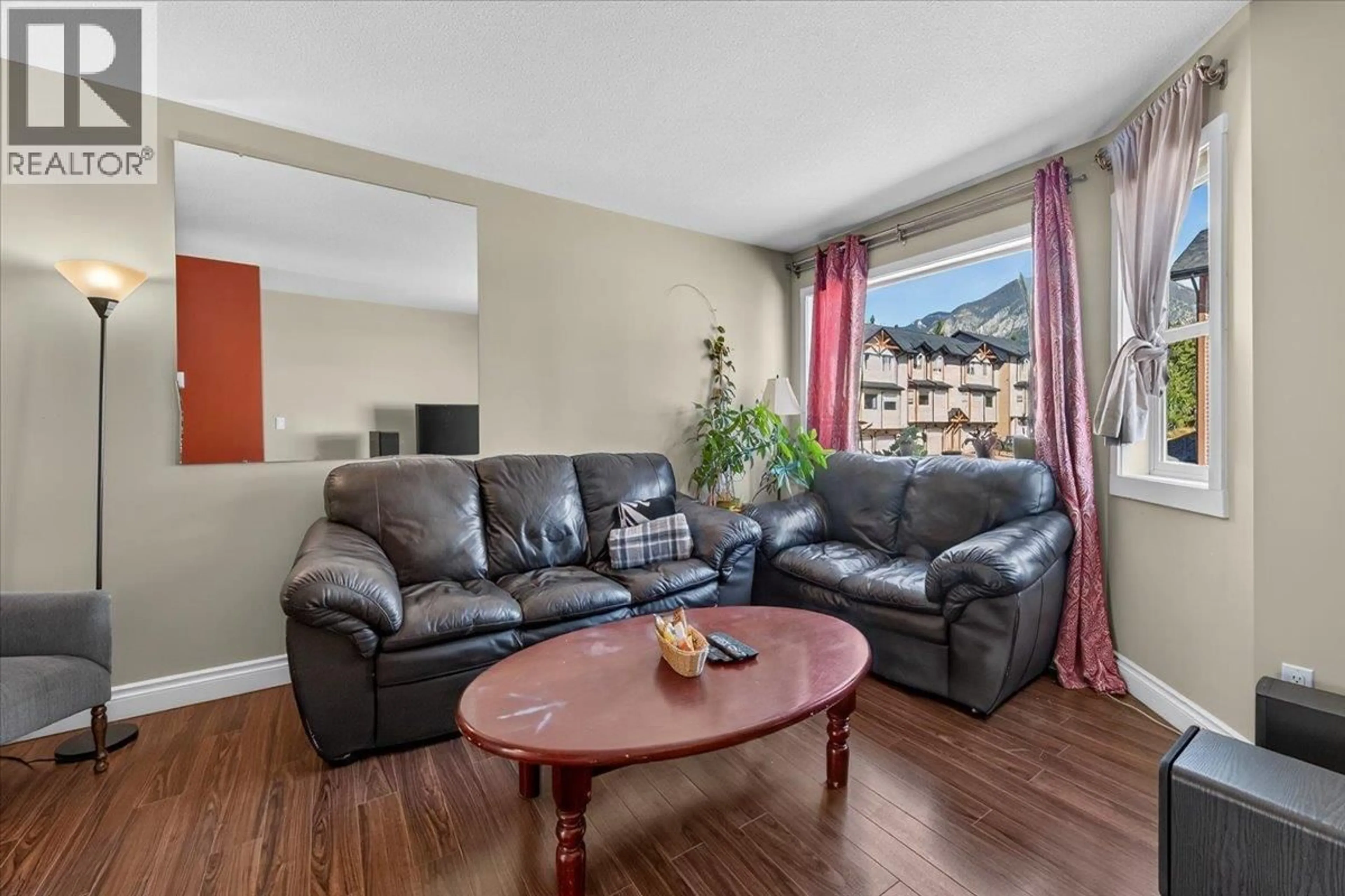 Living room with furniture, wood/laminate floor for 711 - 200 BLACK FOREST TRAIL, Invermere British Columbia V0A1K2