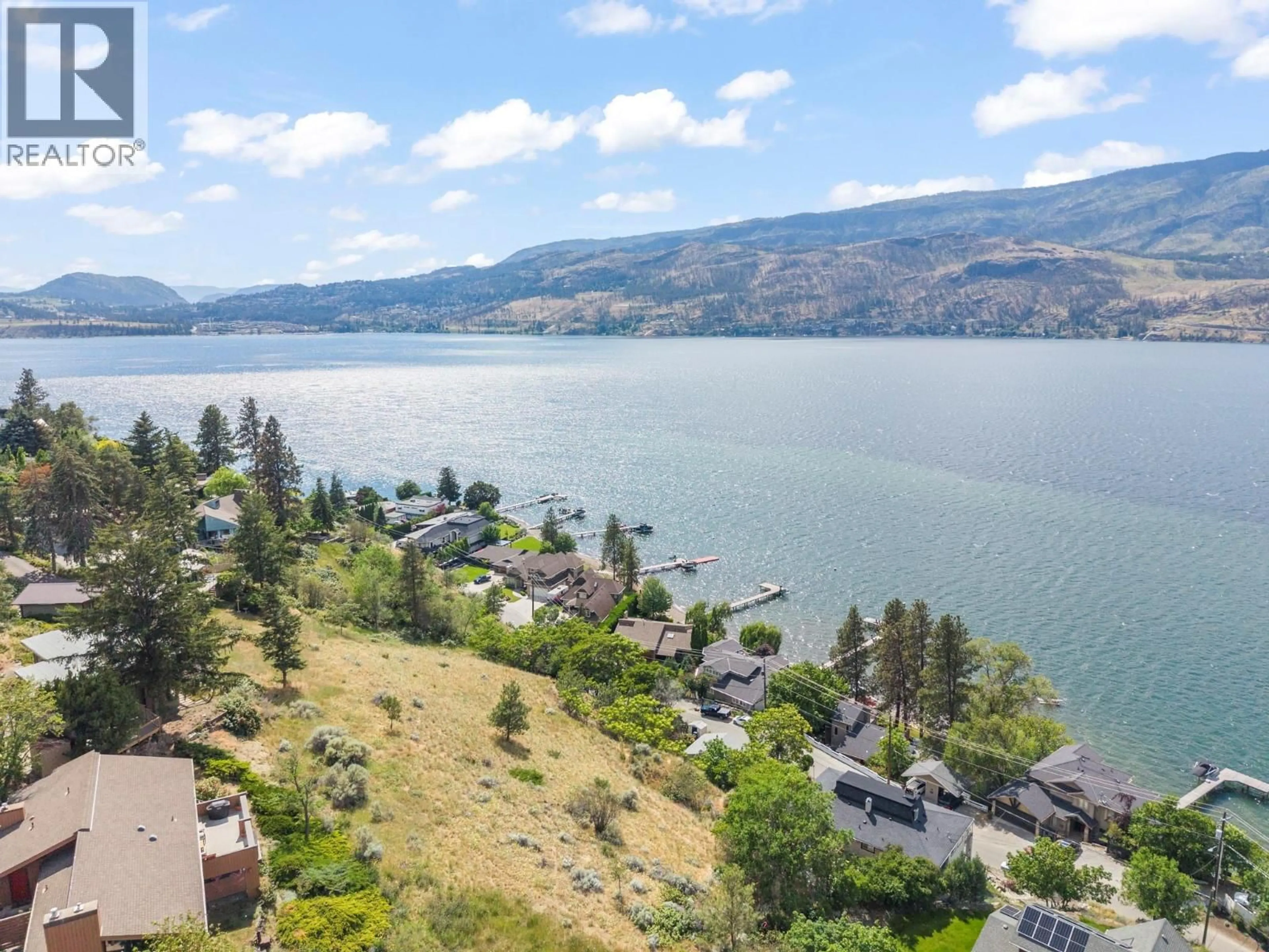 A pic from outside/outdoor area/front of a property/back of a property/a pic from drone, water/lake/river/ocean view for 345 POPLAR POINT DRIVE, Kelowna British Columbia V1Y1Y2