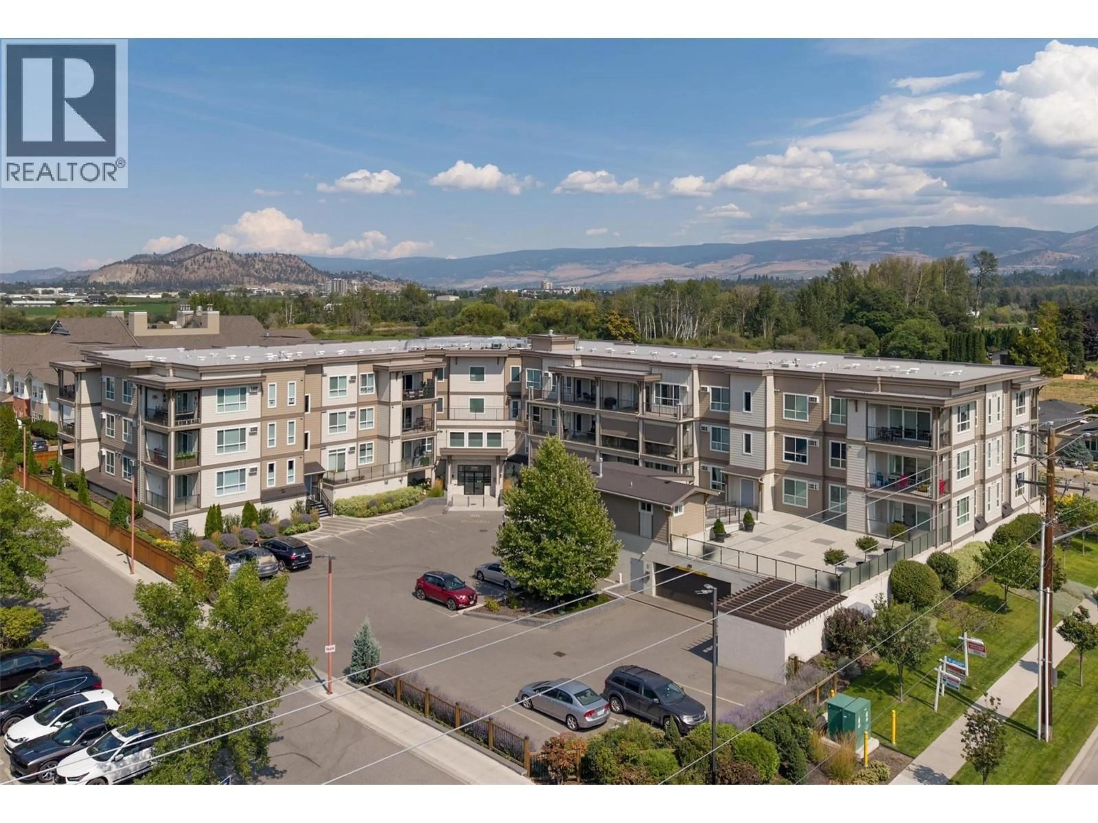 A pic from outside/outdoor area/front of a property/back of a property/a pic from drone, mountain view for 212 - 3090 BURTCH ROAD, Kelowna British Columbia V1W5G9
