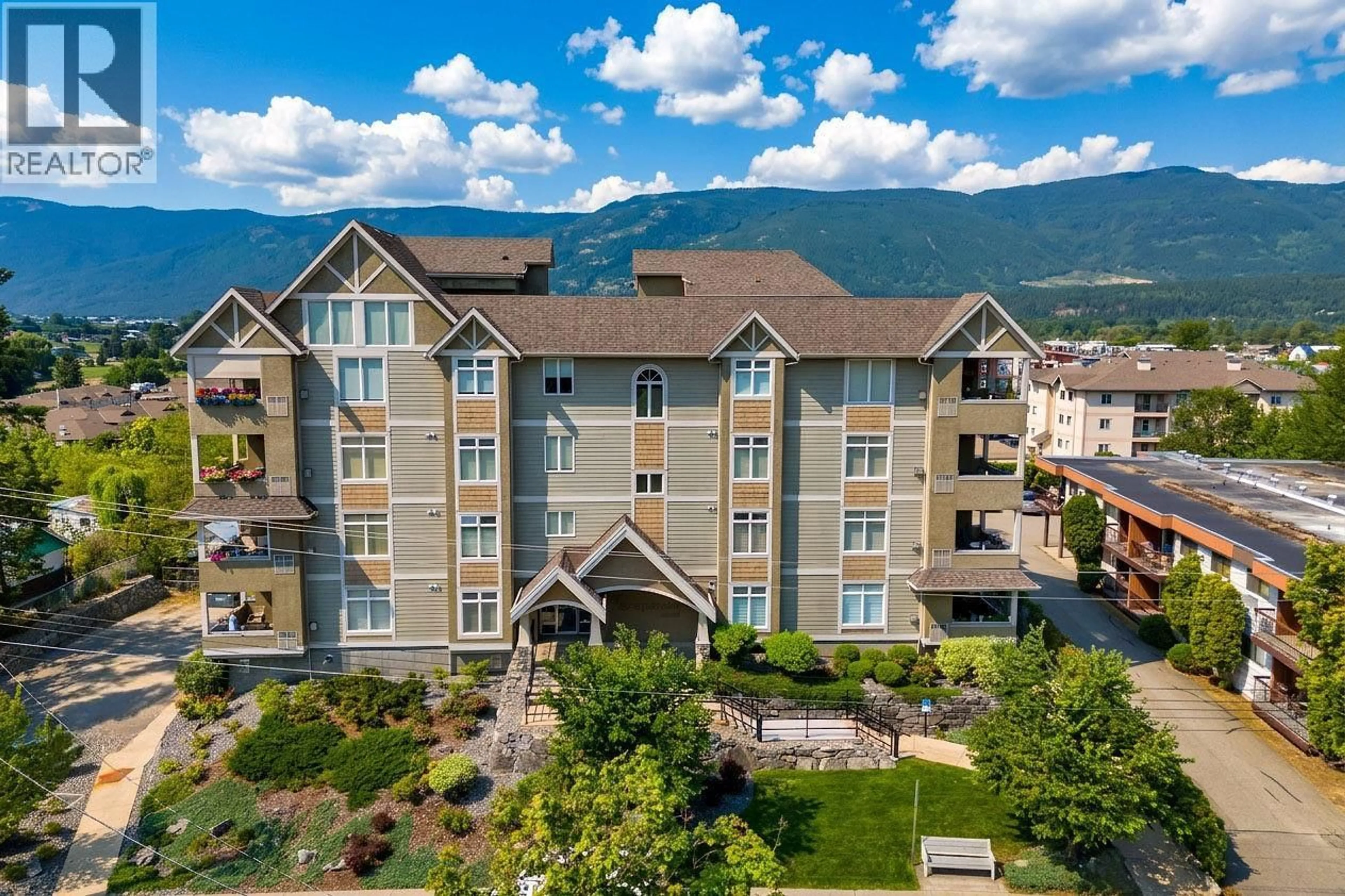 A pic from outside/outdoor area/front of a property/back of a property/a pic from drone, mountain view for 202 - 611 SHUSWAP STREET SOUTHWEST, Salmon Arm British Columbia V1E0A2