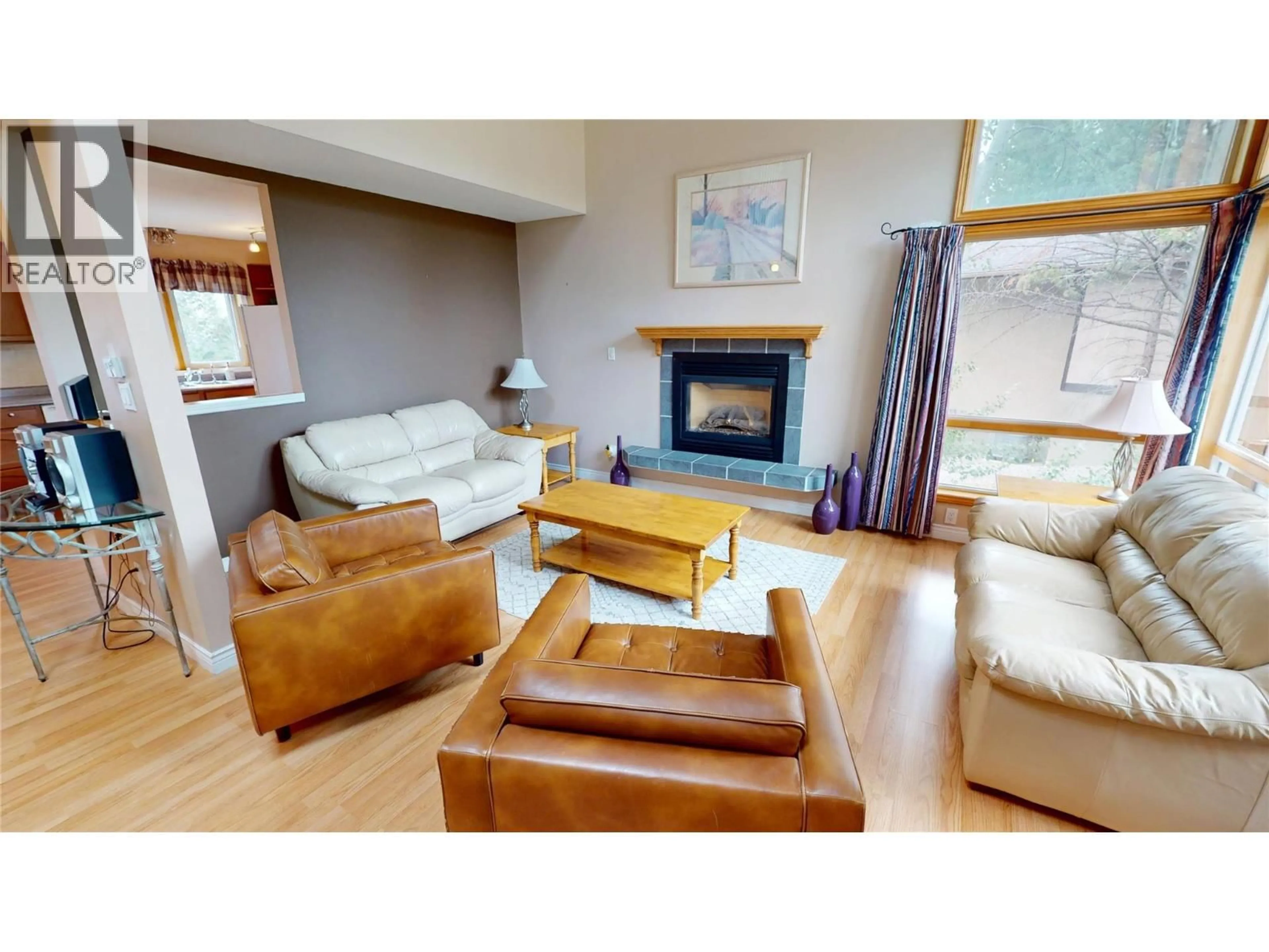Living room with furniture, wood/laminate floor for 4978 TIMBERSIDE PLACE, Invermere British Columbia V0A1K3