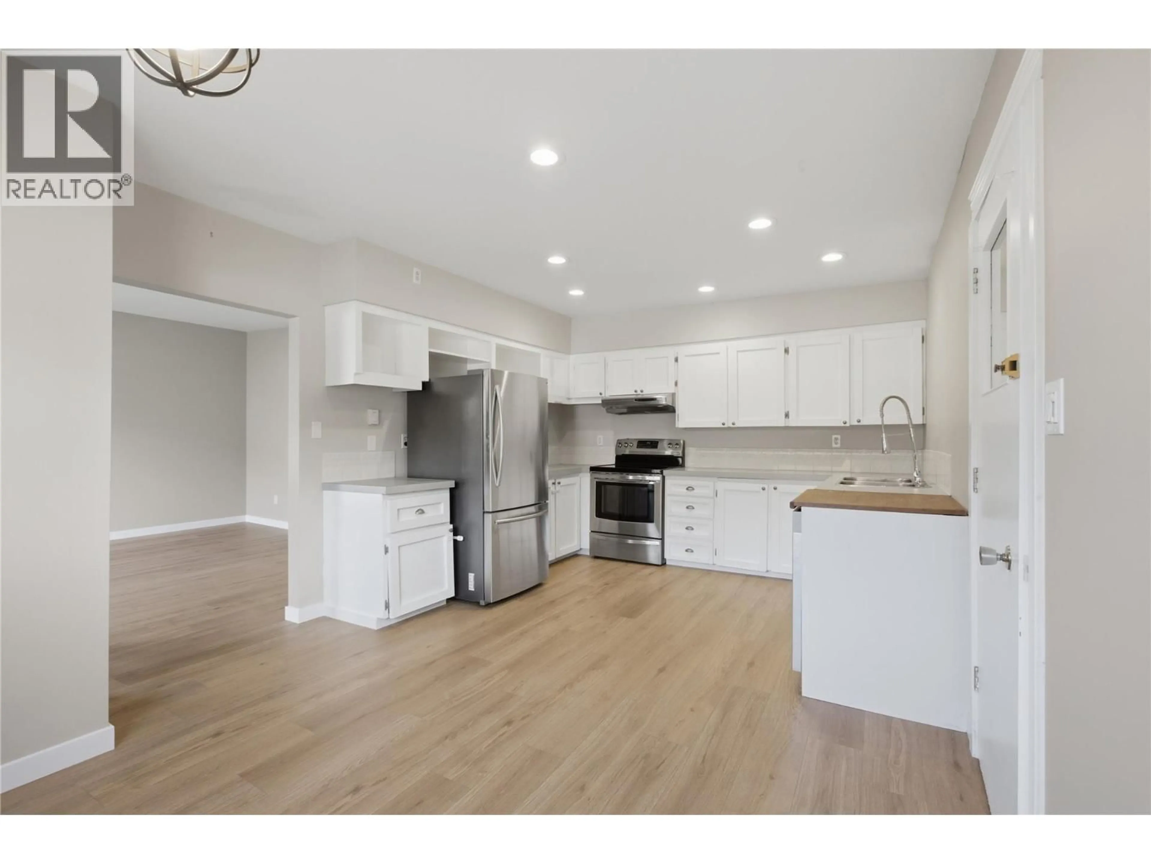 Open concept kitchen, wood/laminate floor for 2231/2233 VALLEYVIEW DRIVE, Kamloops British Columbia V2C4C8