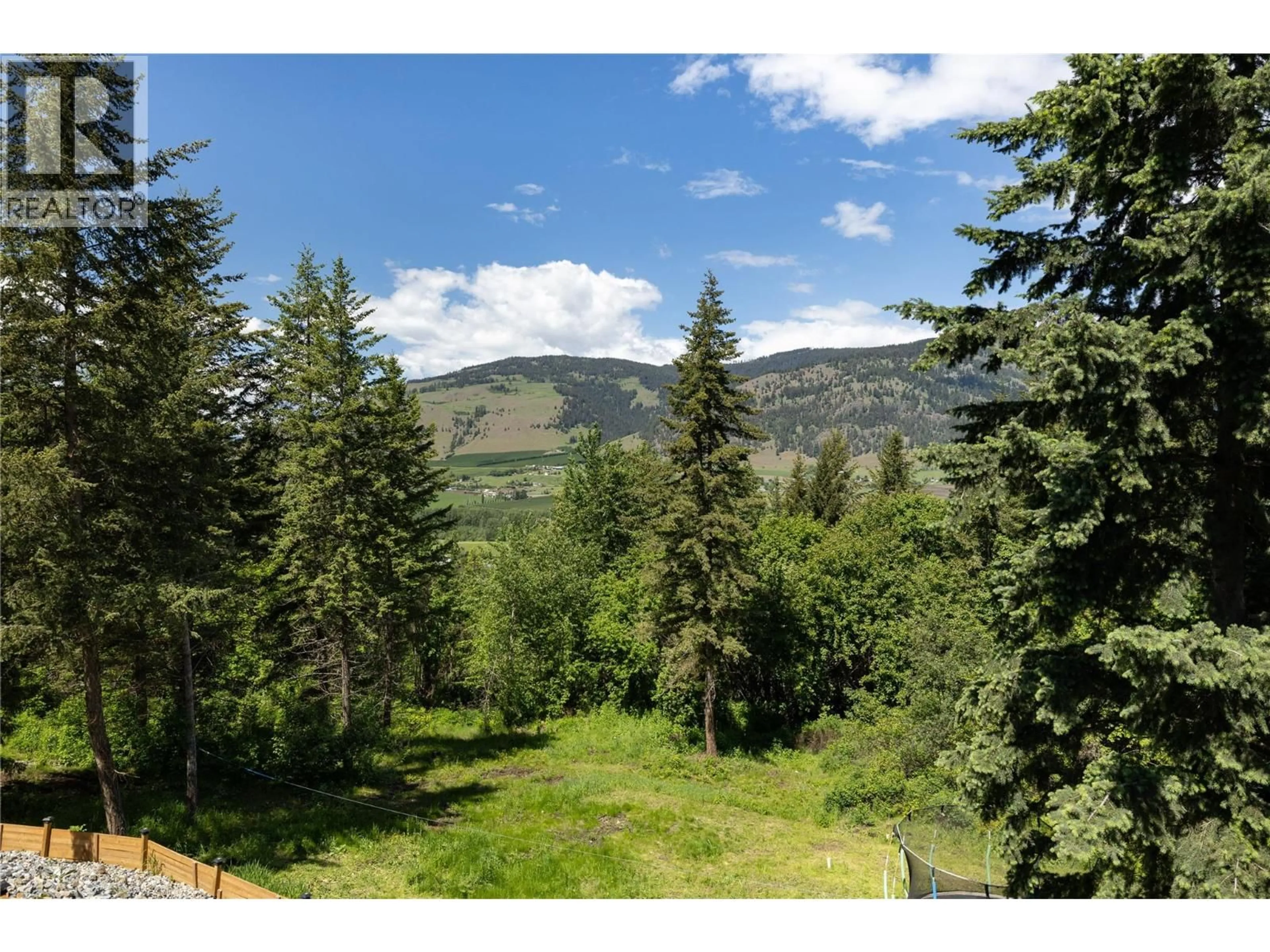 A pic from outside/outdoor area/front of a property/back of a property/a pic from drone, forest/trees view for 4006 COACHWOOD CLOSE, Coldstream British Columbia V1B3Y4