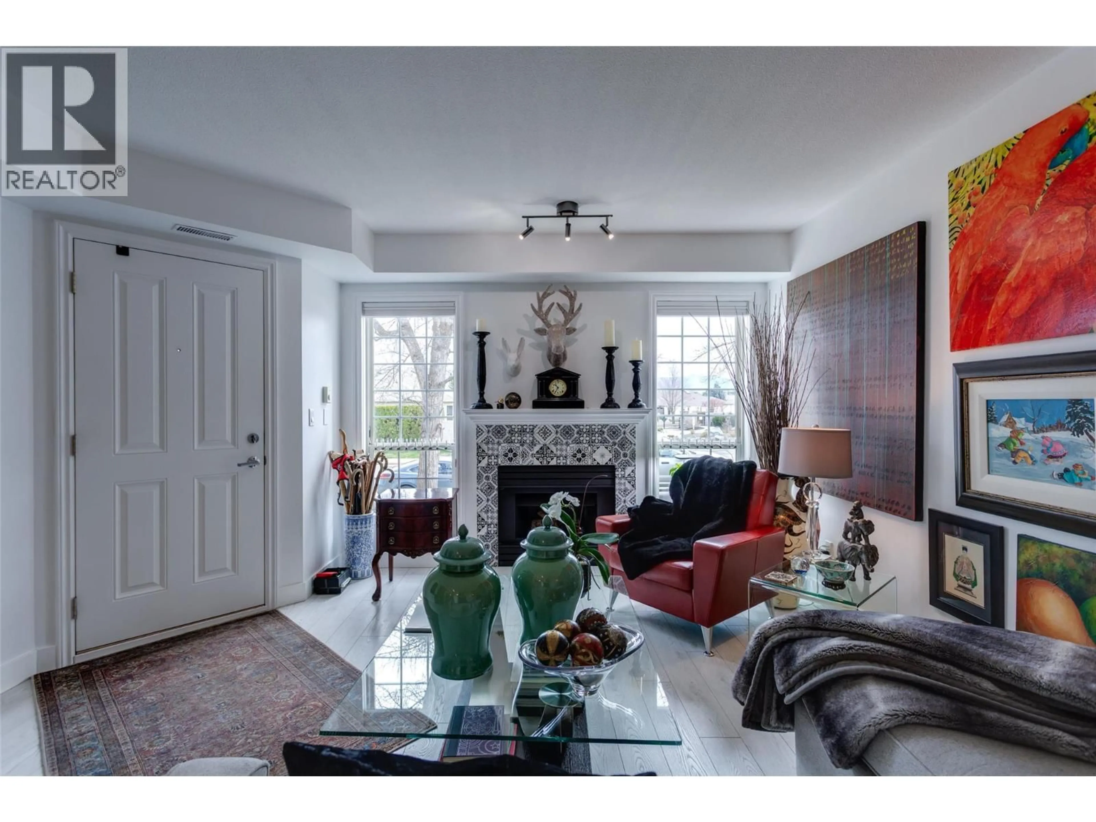 Living room with furniture, ceramic/tile floor for 113 - 2350 STILLINGFLEET ROAD, Kelowna British Columbia V1W3X9