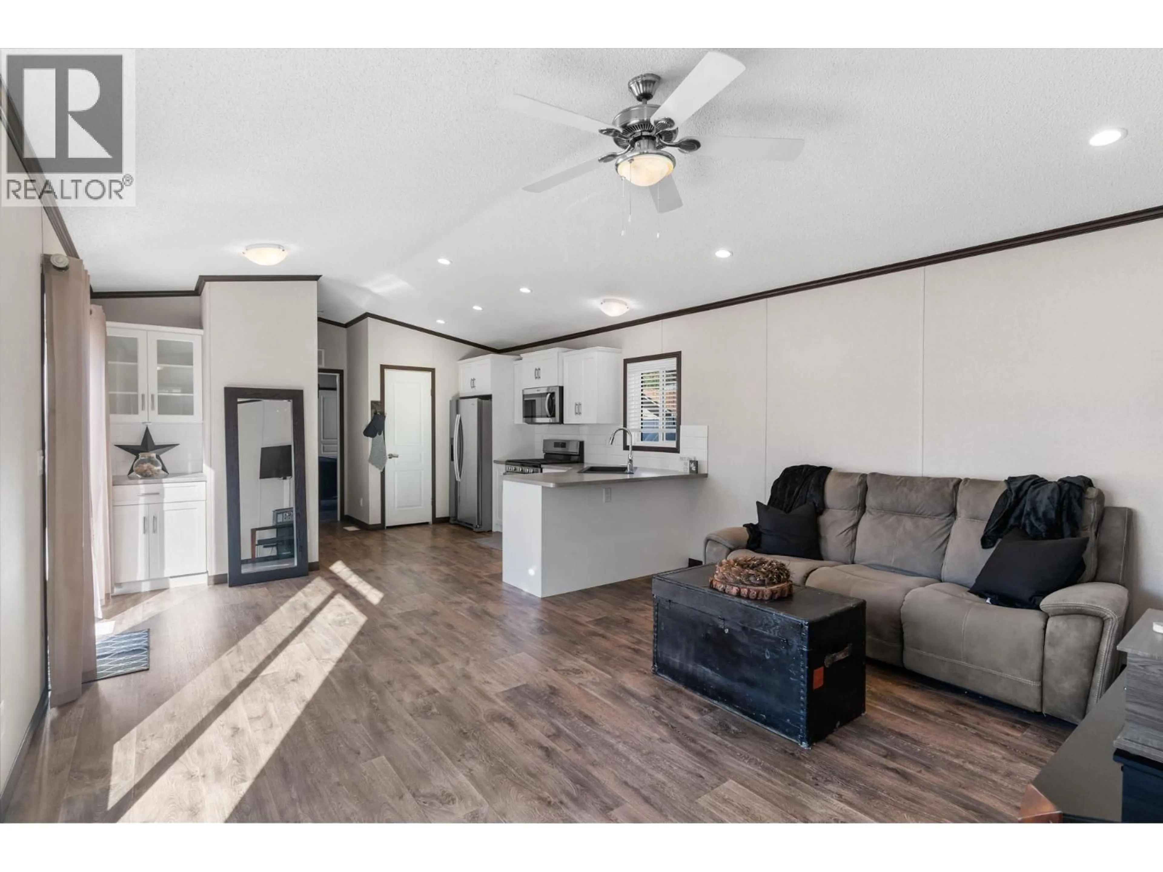 Open concept kitchen, wood/laminate floor for 201 - 1699 ROSS ROAD, West Kelowna British Columbia V1Z1L8