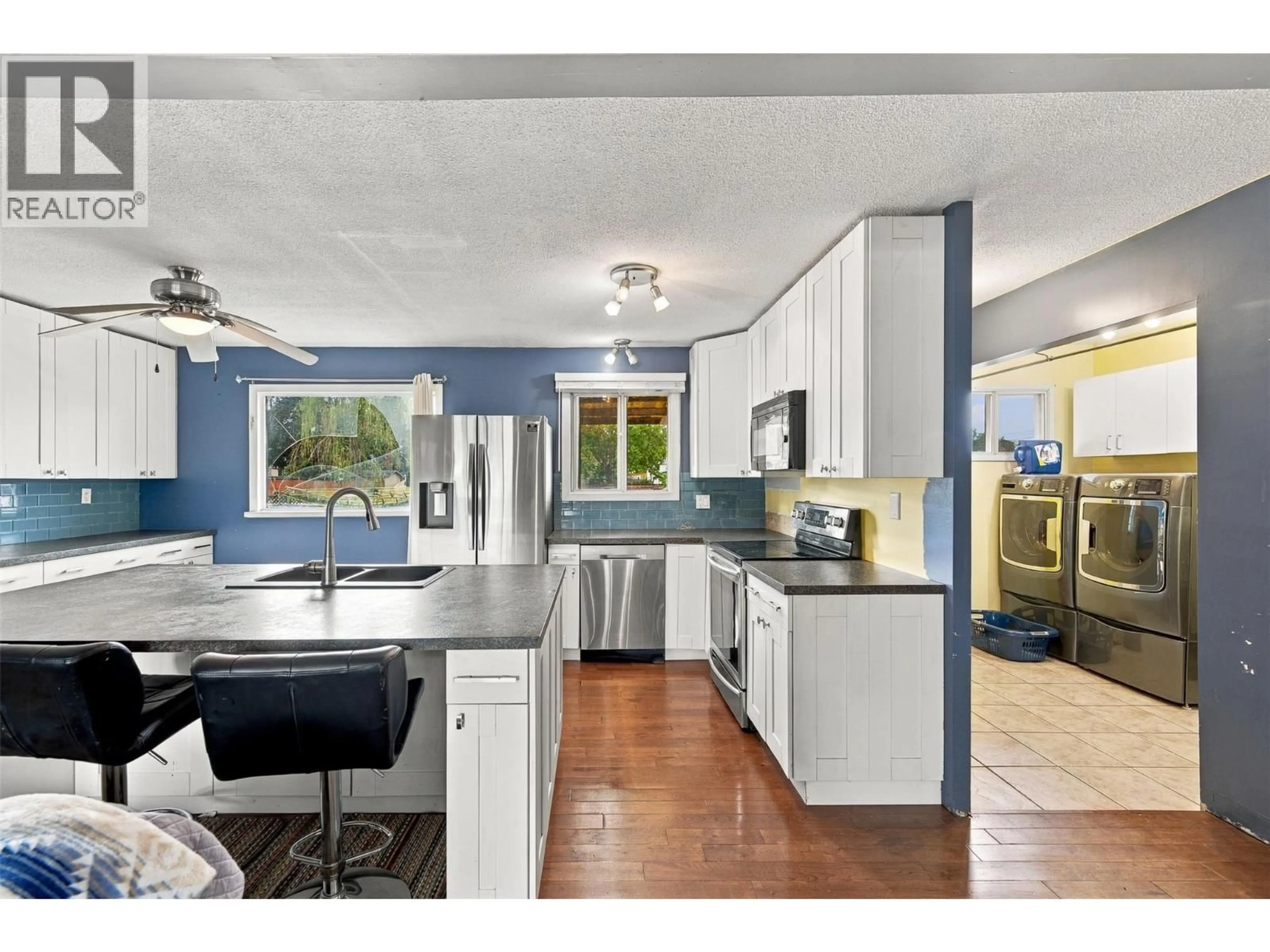Open concept kitchen, ceramic/tile floor for 1495 CORNWALL ROAD, Kelowna British Columbia V1X1P2