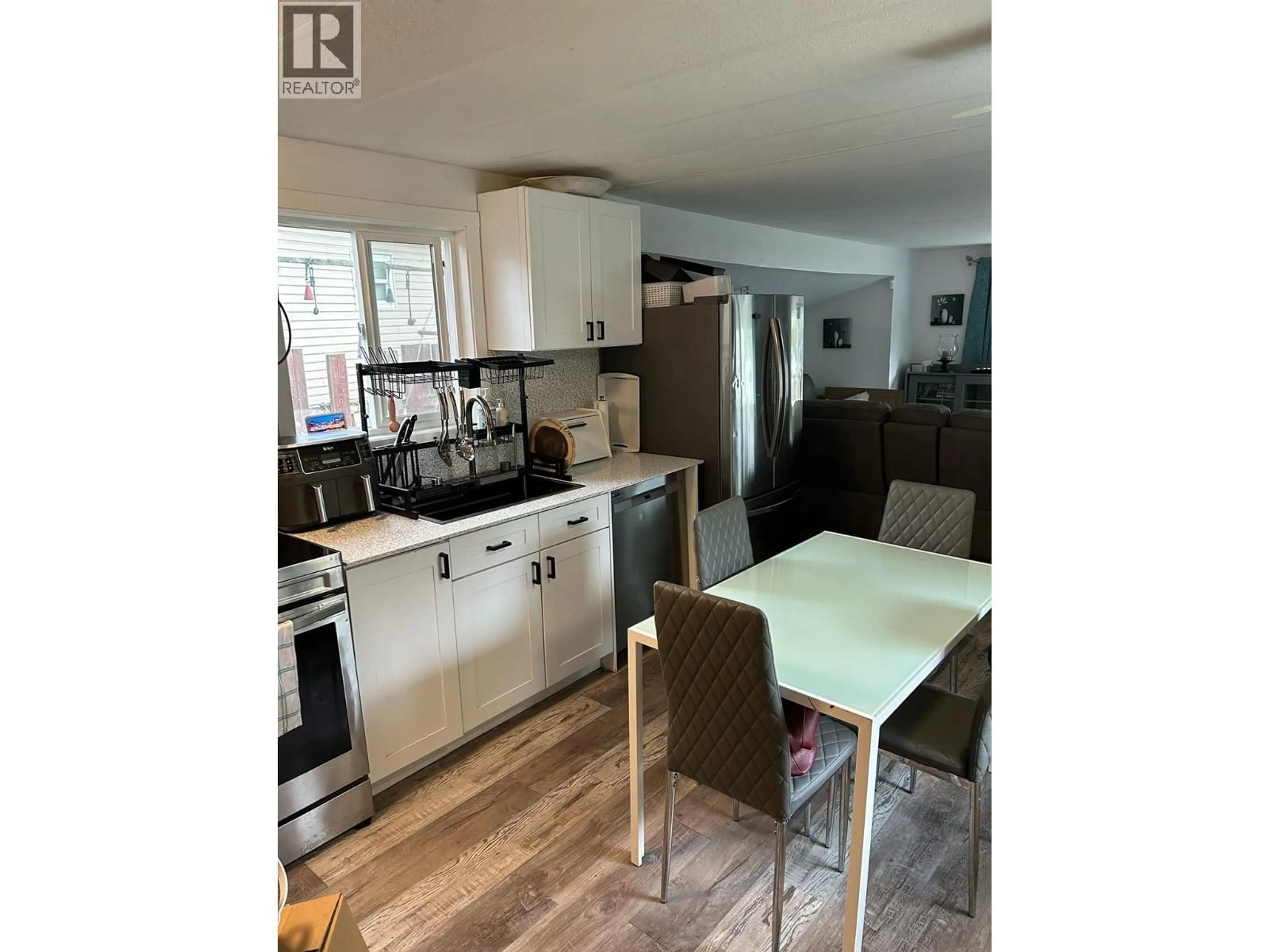 Open concept kitchen, wood/laminate floor for 5317 FREDA AVENUE, Kamloops British Columbia V2C5A6