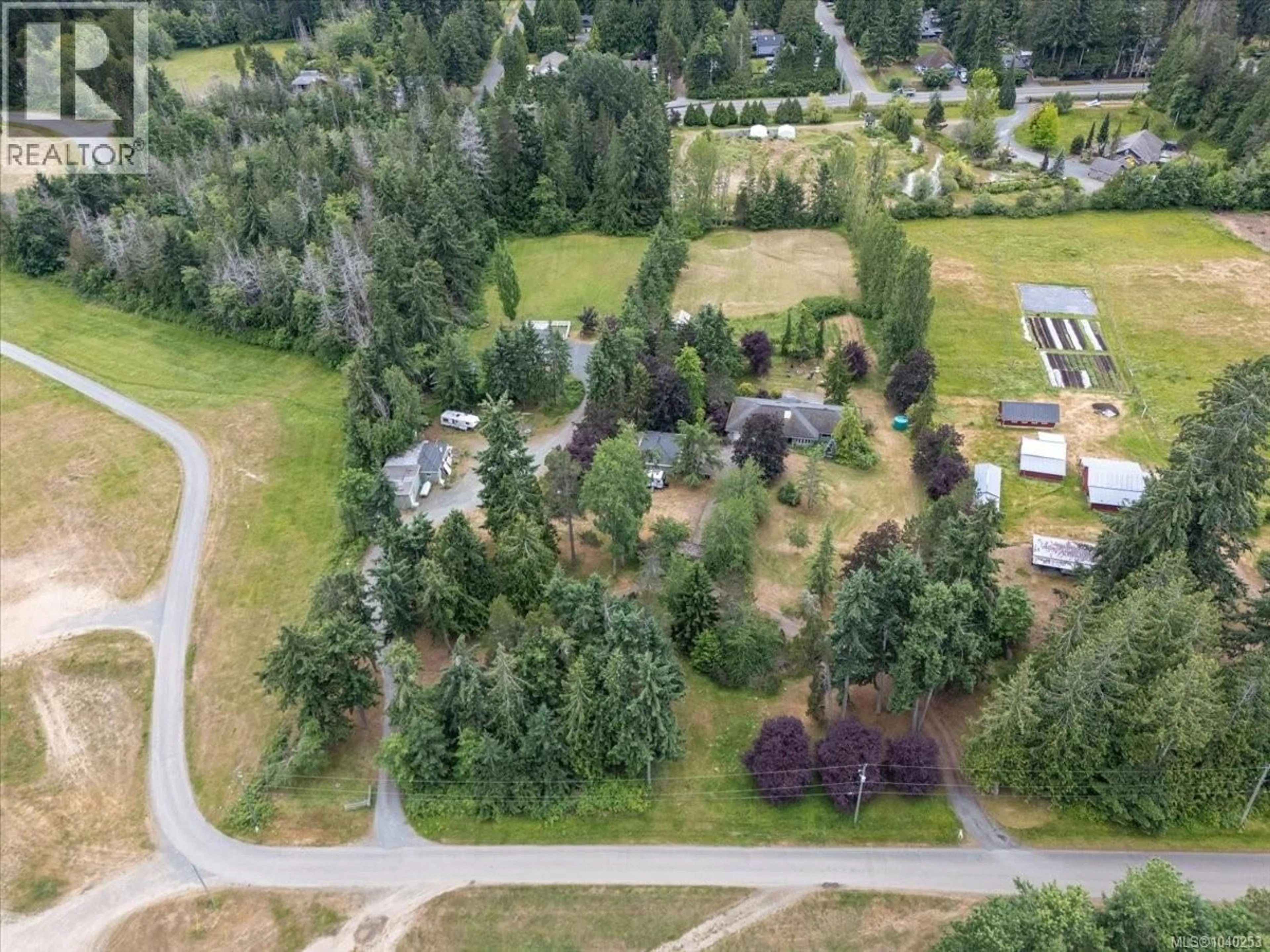 A pic from outside/outdoor area/front of a property/back of a property/a pic from drone, forest/trees view for 880 GARDEN ROAD EAST, Qualicum Beach British Columbia V9K1N2