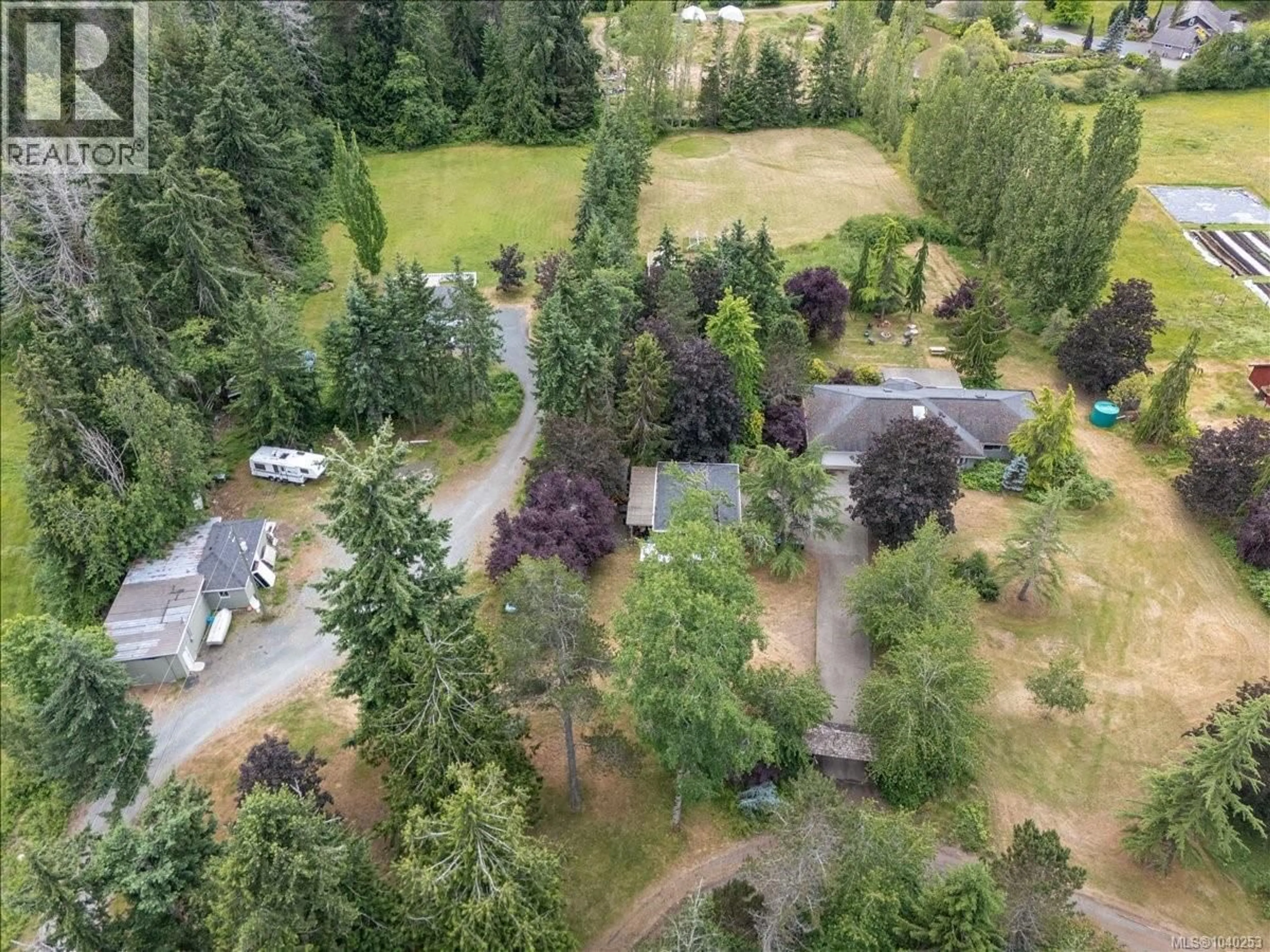 A pic from outside/outdoor area/front of a property/back of a property/a pic from drone, forest/trees view for 880 GARDEN ROAD EAST, Qualicum Beach British Columbia V9K1N2