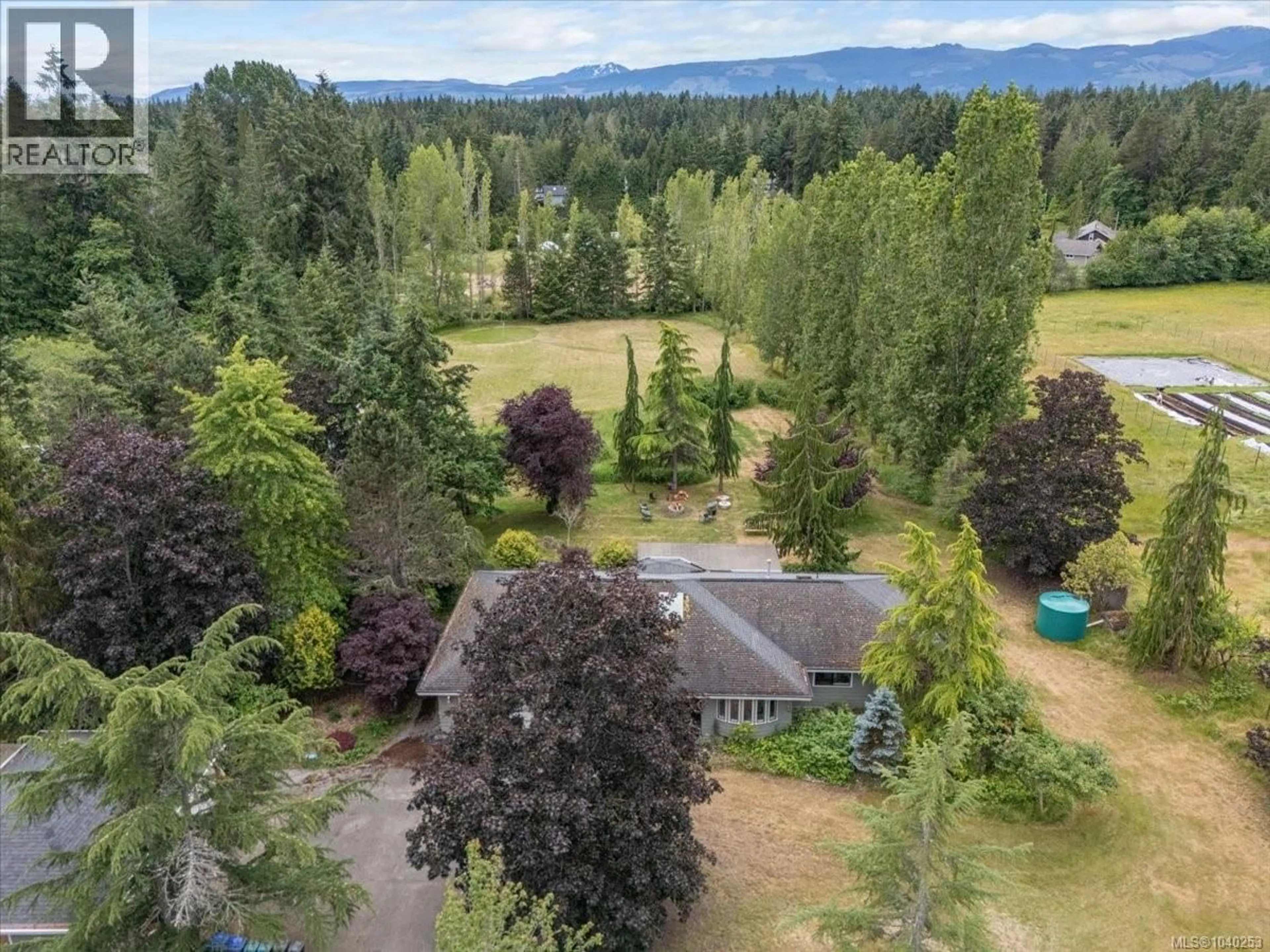 A pic from outside/outdoor area/front of a property/back of a property/a pic from drone, mountain view for 880 GARDEN ROAD EAST, Qualicum Beach British Columbia V9K1N2