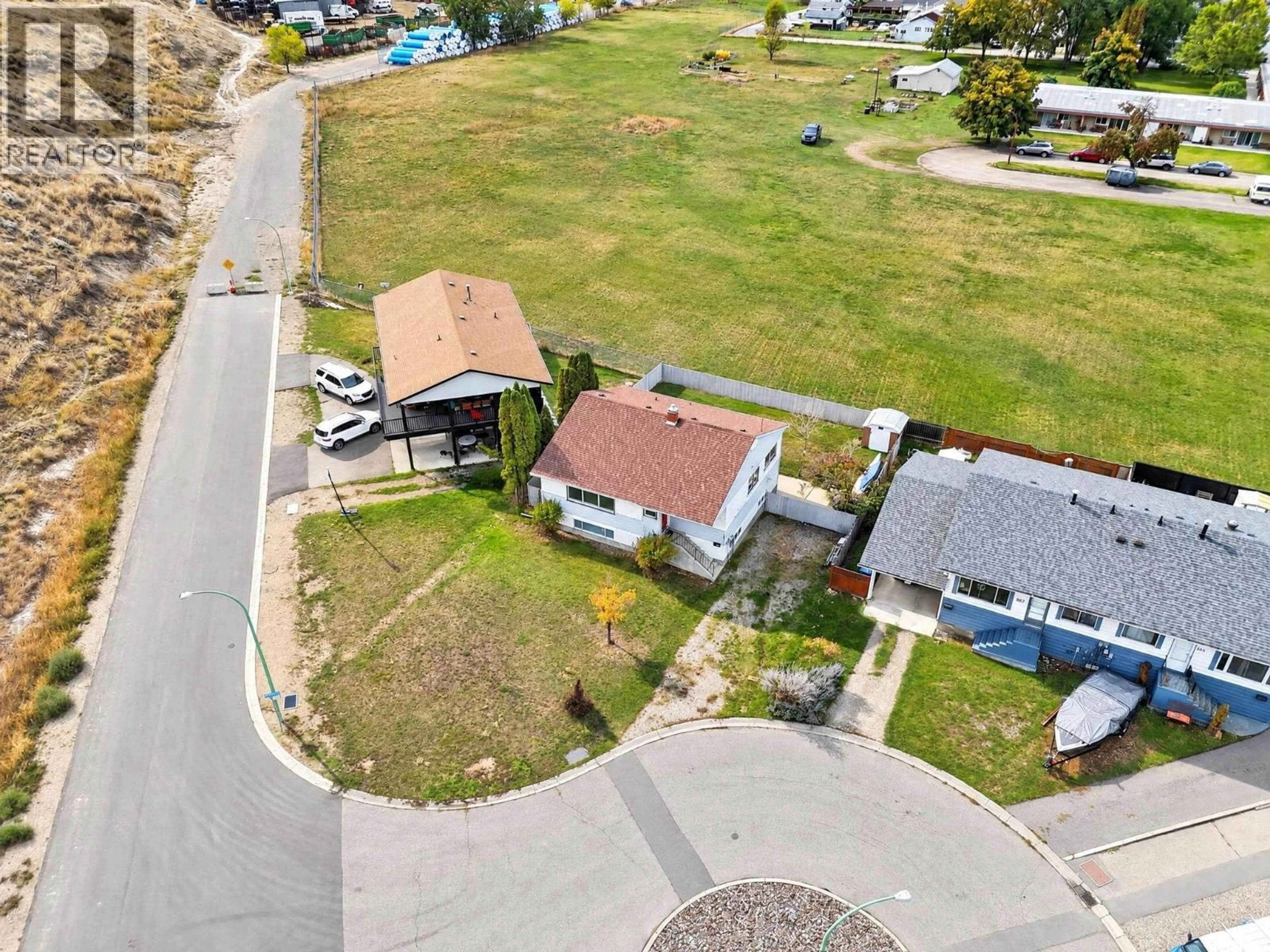A pic from outside/outdoor area/front of a property/back of a property/a pic from drone, street for 879 TRENCH COURT, Kelowna British Columbia V1Y8H3