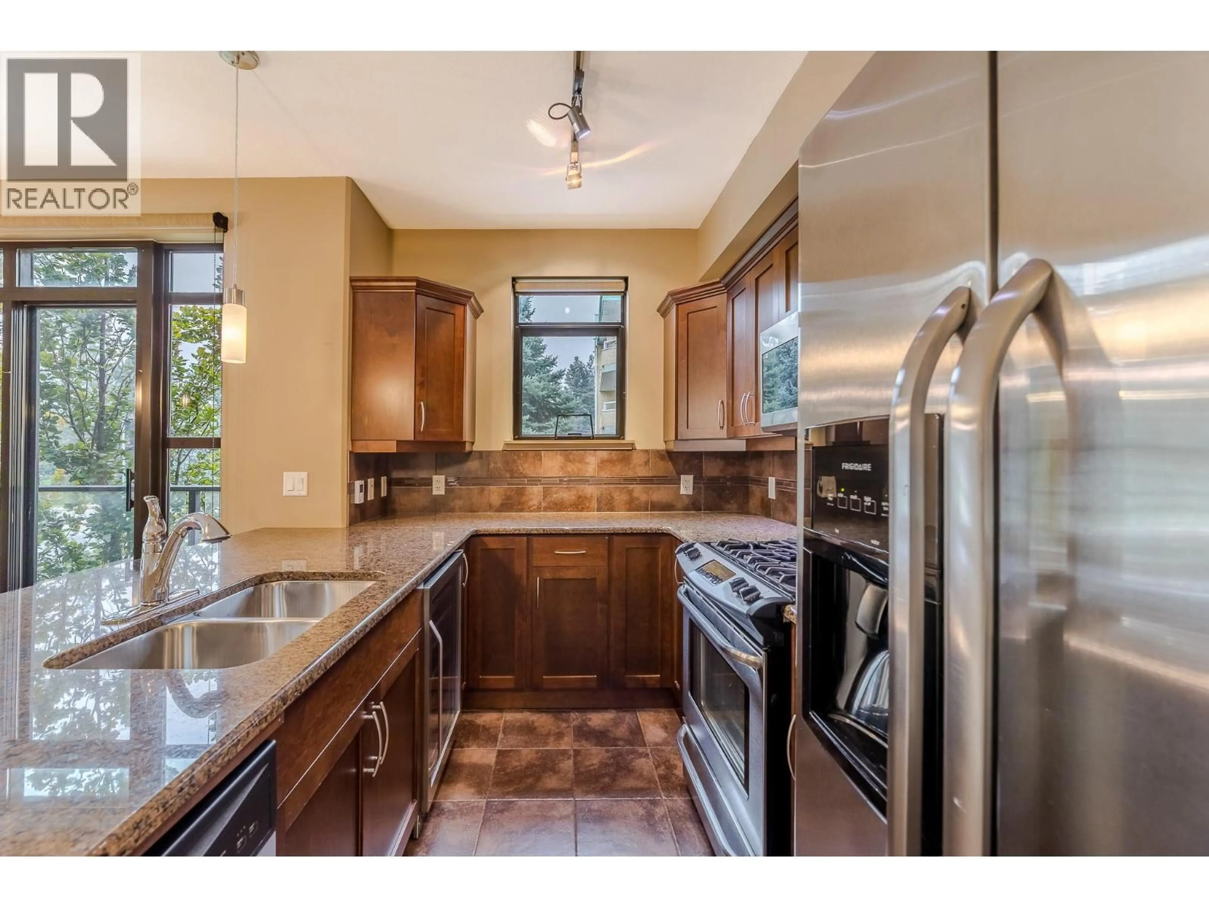 Open concept kitchen, ceramic/tile floor for 204 - 3589 SKAHA LAKE ROAD, Penticton British Columbia V2A7K2