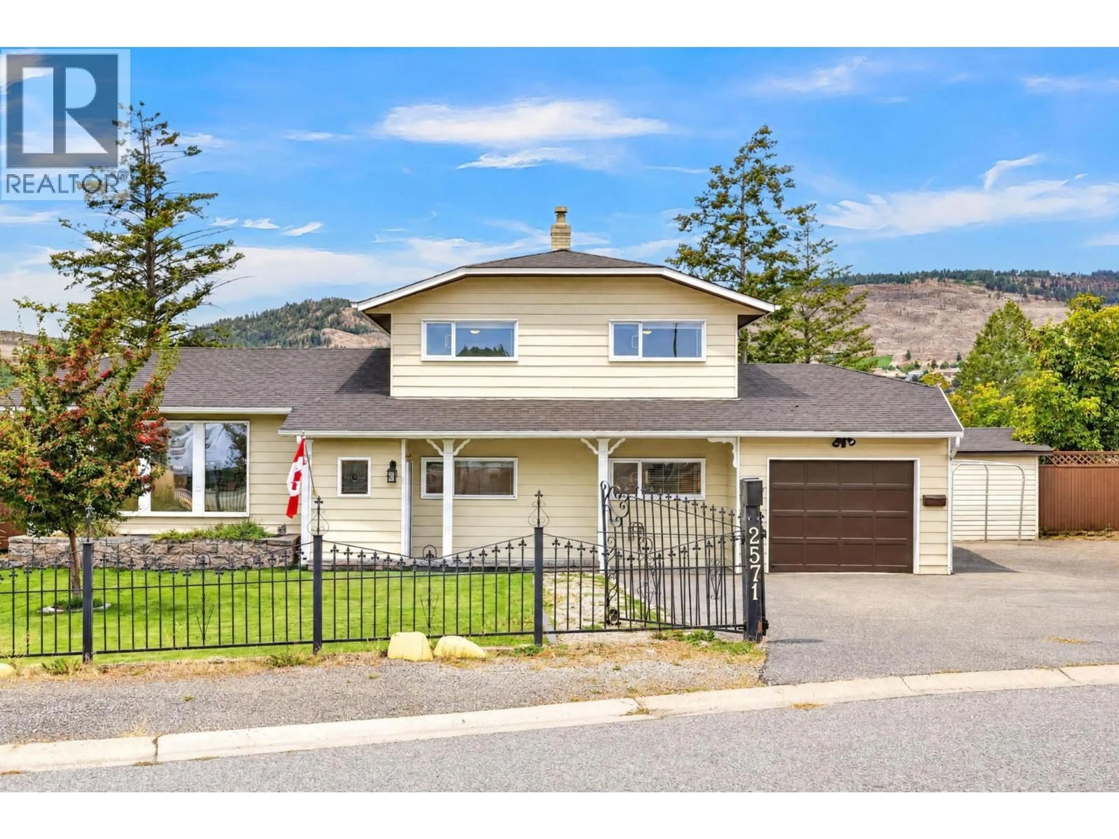 Home with vinyl exterior material, street for 2571 PINERIDGE PLACE, West Kelowna British Columbia V4T2J7