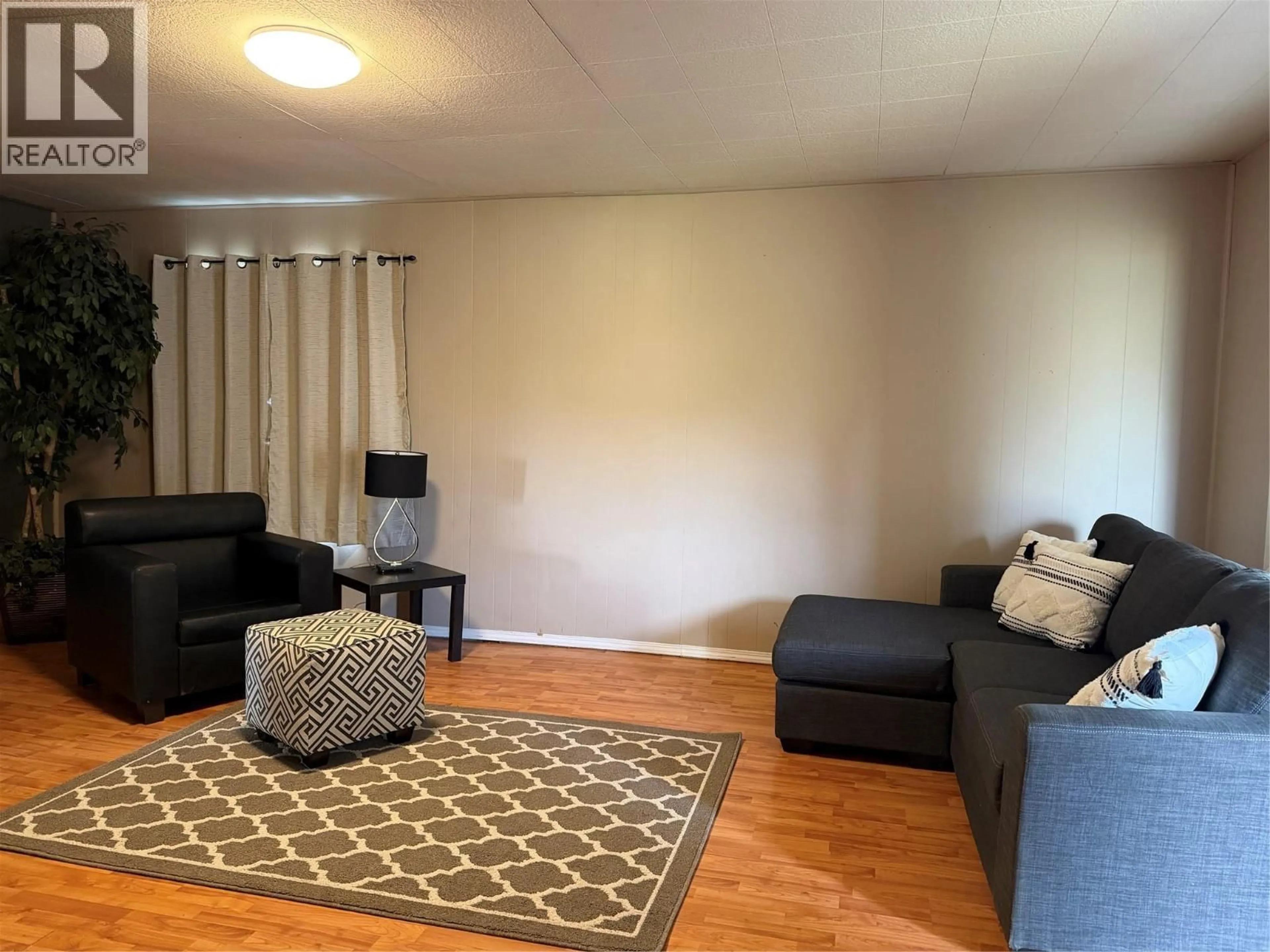 Living room with furniture, unknown for 1009 95 AVENUE, Dawson Creek British Columbia V1G1H9
