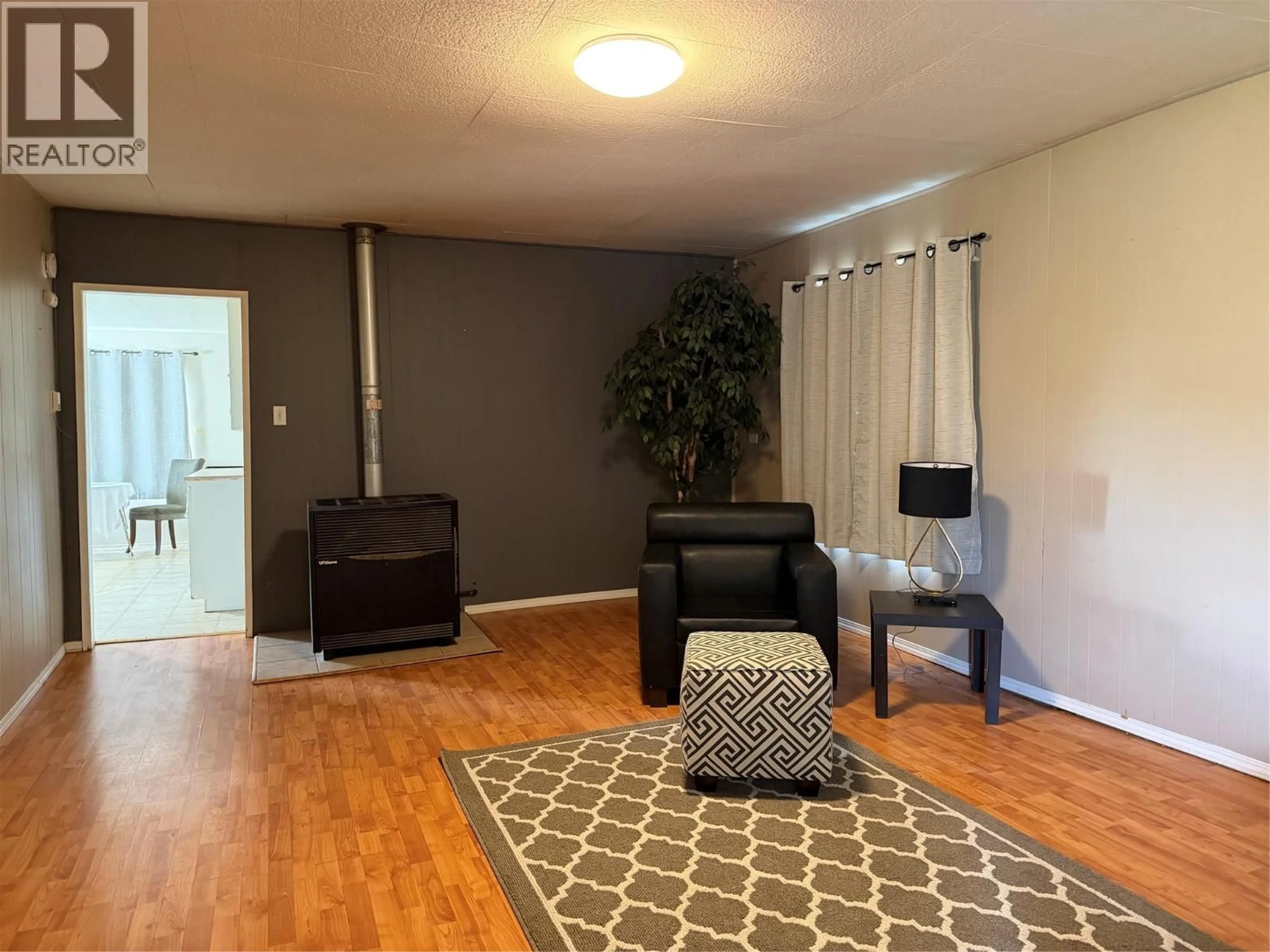 Living room with furniture, unknown for 1009 95 AVENUE, Dawson Creek British Columbia V1G1H9