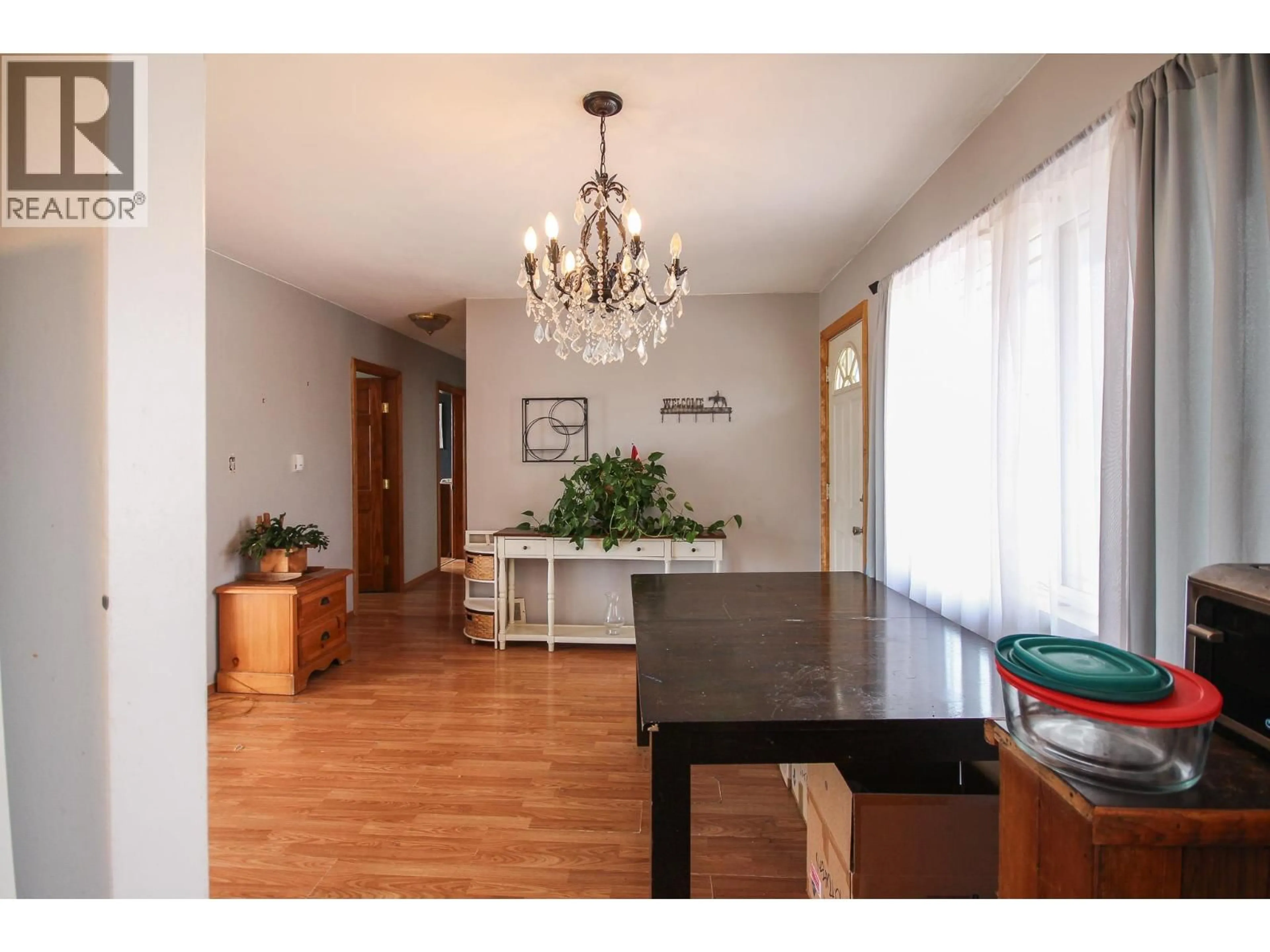 Dining room, wood/laminate floor for 1621 95 AVENUE, Dawson Creek British Columbia V1G1K2