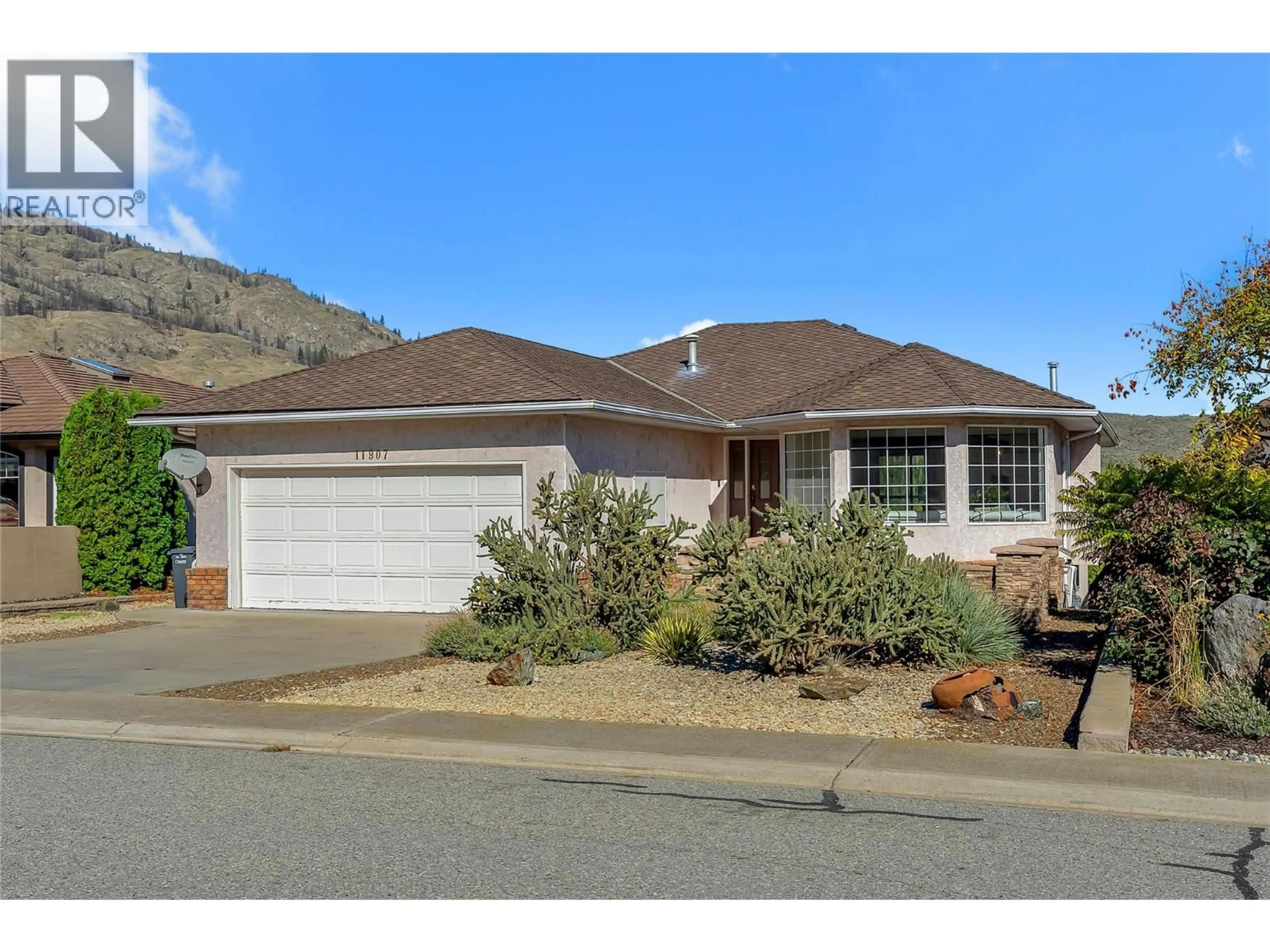 Home with vinyl exterior material, street for 11907 QUAIL RIDGE PLACE, Osoyoos British Columbia V0H1V4