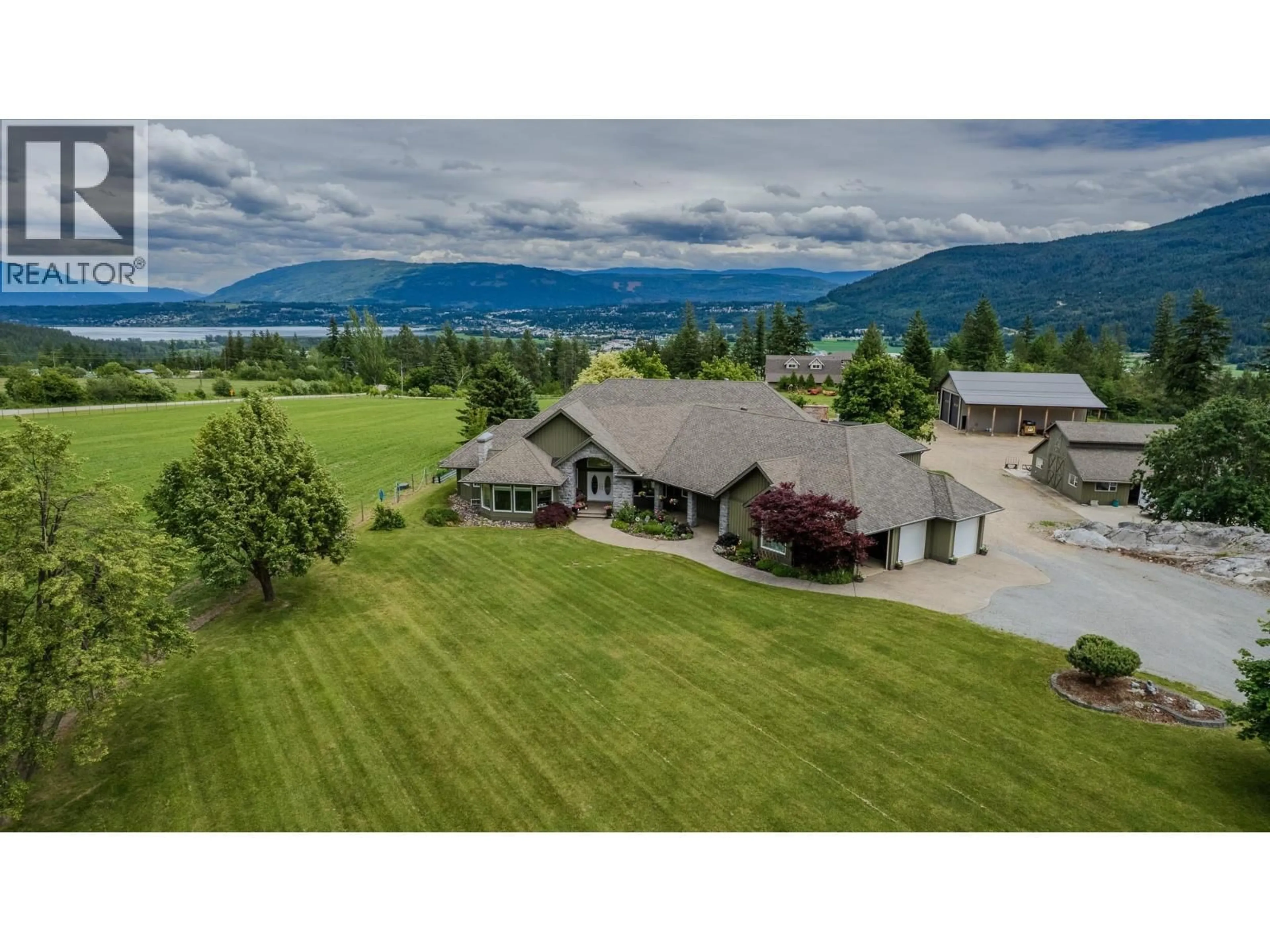 A pic from outside/outdoor area/front of a property/back of a property/a pic from drone, mountain view for 1 - 6500 15TH AVENUE SOUTHWEST, Salmon Arm British Columbia V1E1R5