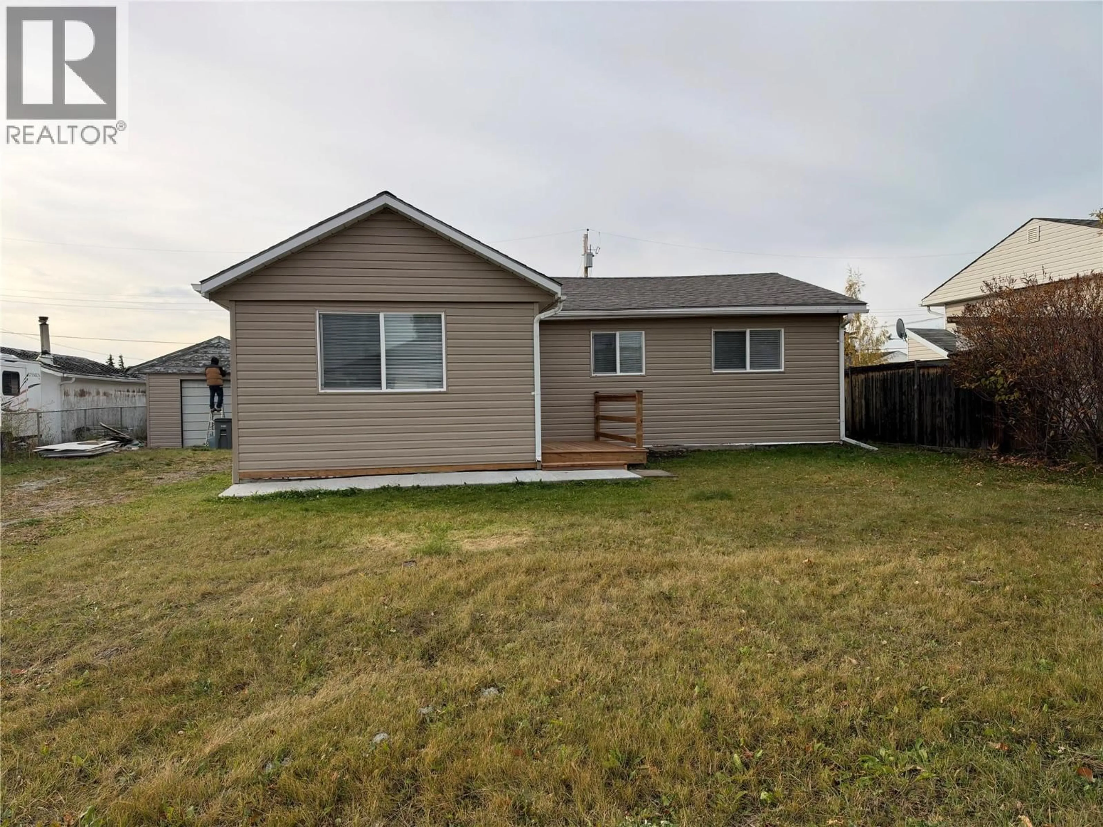 Home with vinyl exterior material, street for 1217 114 AVENUE, Dawson Creek British Columbia V1G3A6