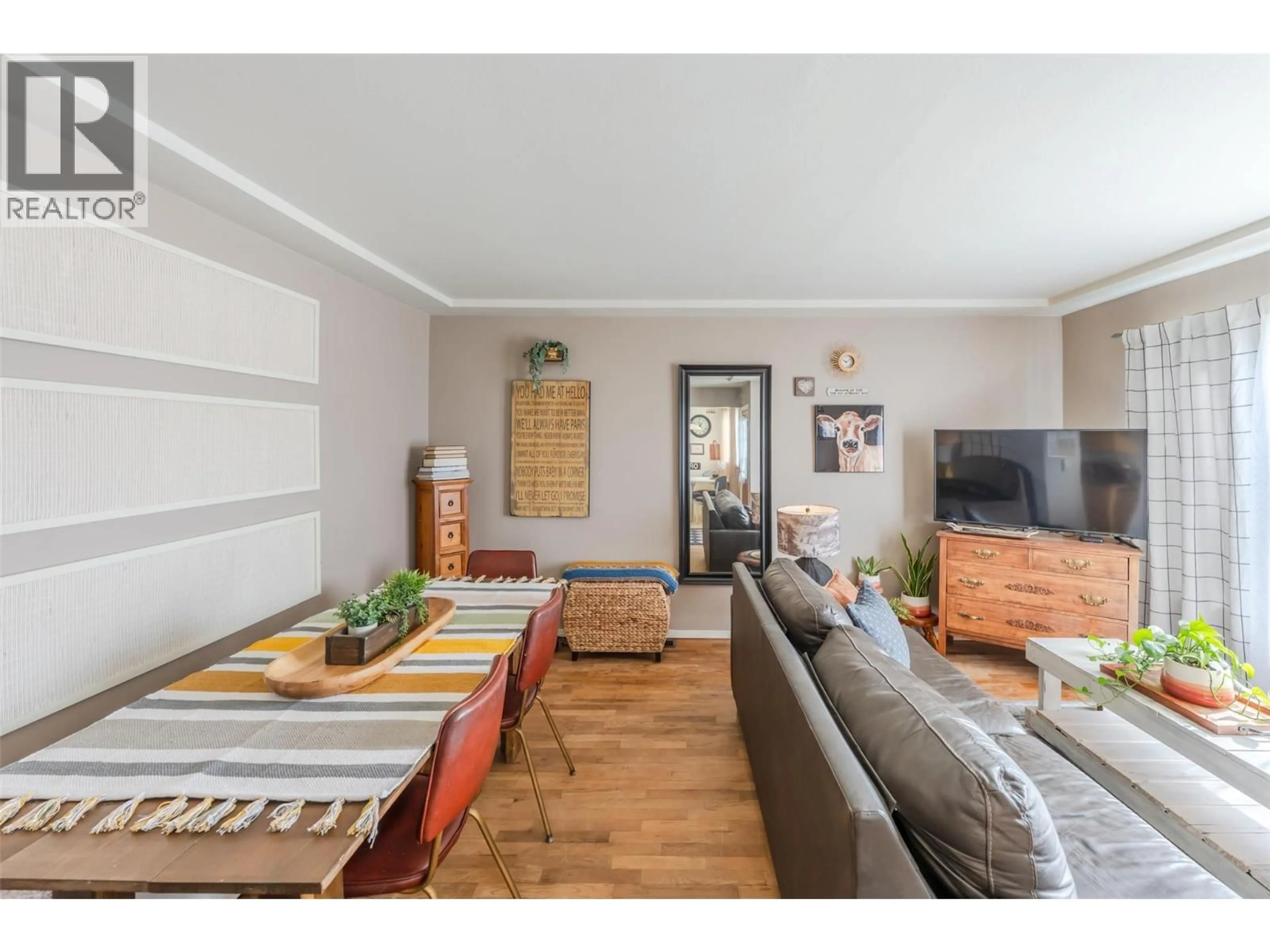 Living room with furniture, wood/laminate floor for 797 FORESTBROOK DRIVE, Penticton British Columbia V2A2E6