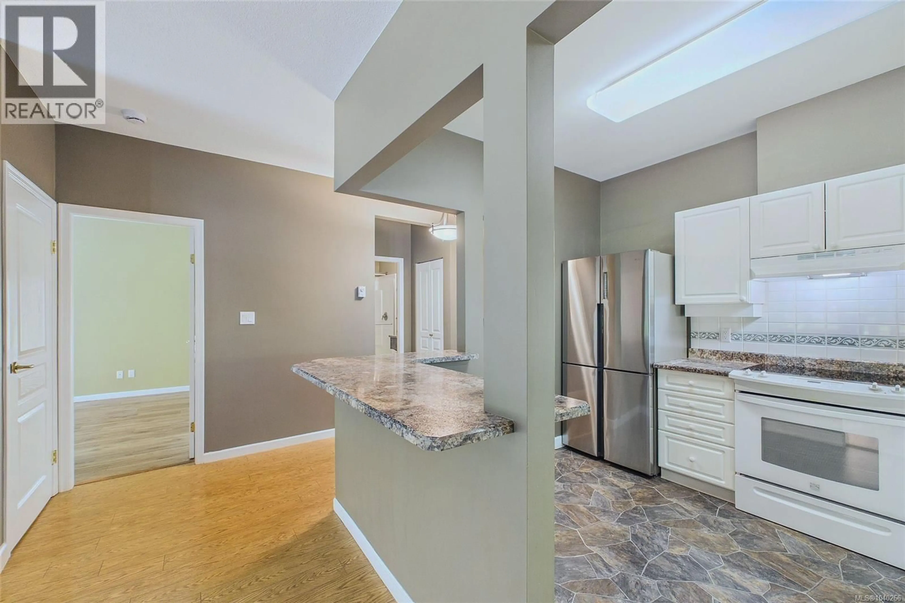 Open concept kitchen, ceramic/tile floor for 101 - 5650 EDGEWATER LANE, Nanaimo British Columbia V9T6K1