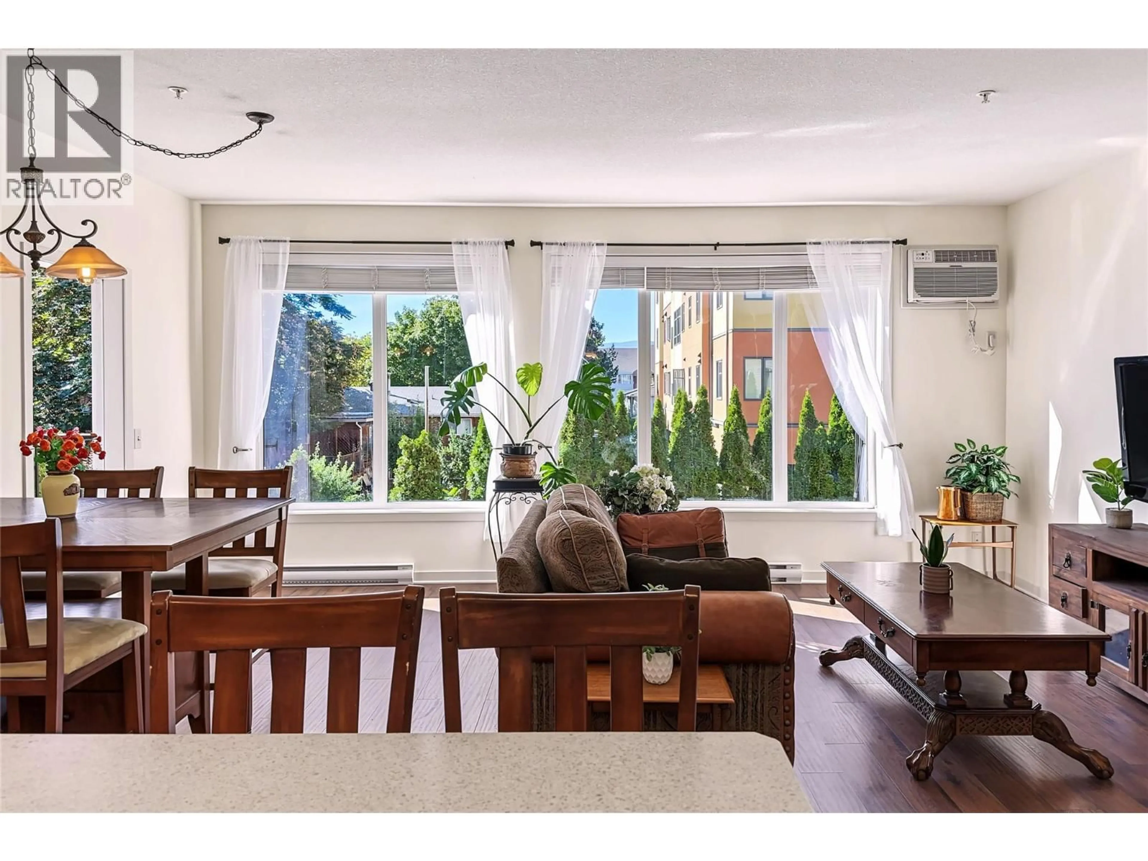 Dining room, wood/laminate floor for 103 - 130 BARBER ROAD, Kelowna British Columbia V1X3V4