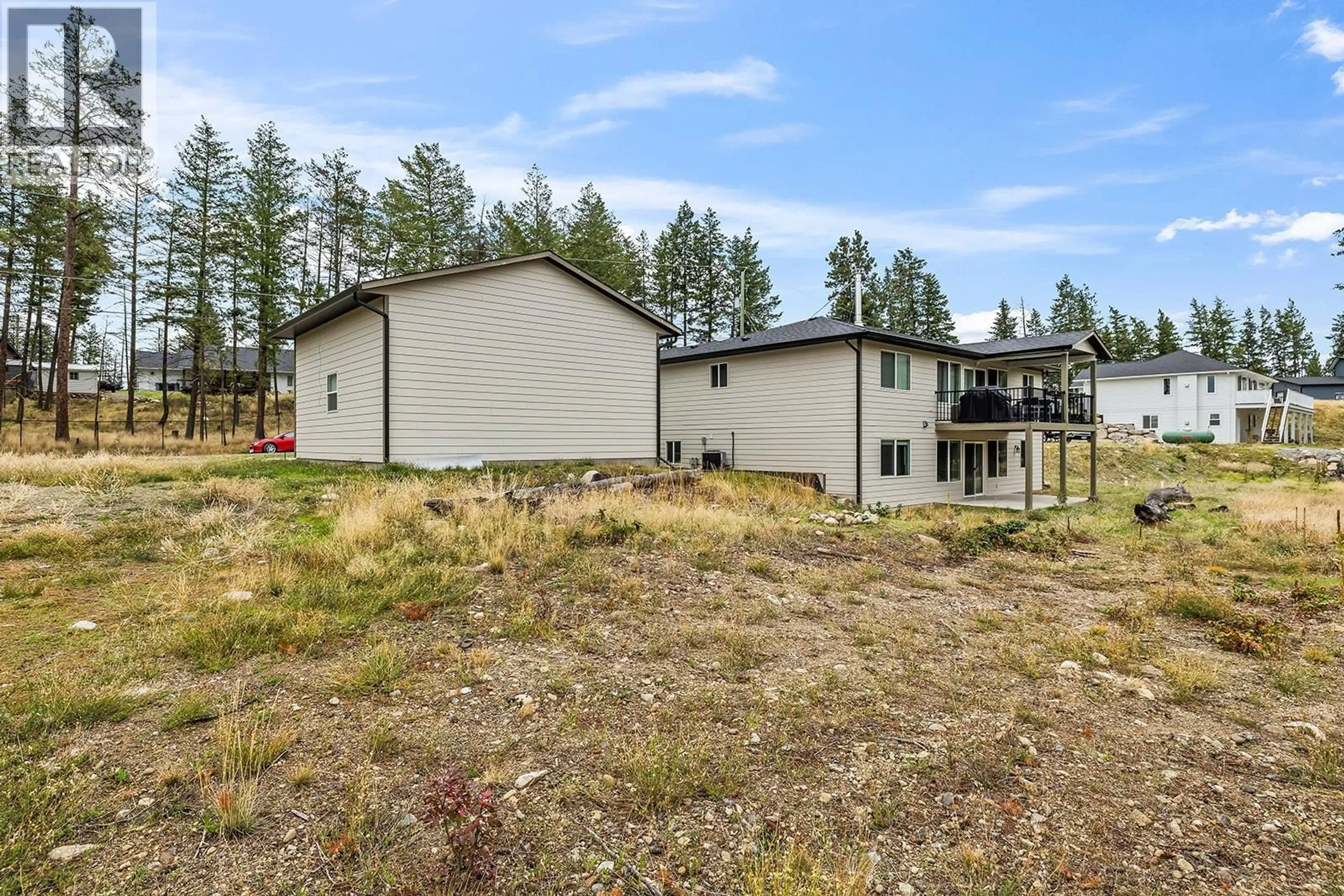 A pic from outside/outdoor area/front of a property/back of a property/a pic from drone, mountain view for 7151 DUNWATERS ROAD, Kelowna British Columbia V1Z3W5