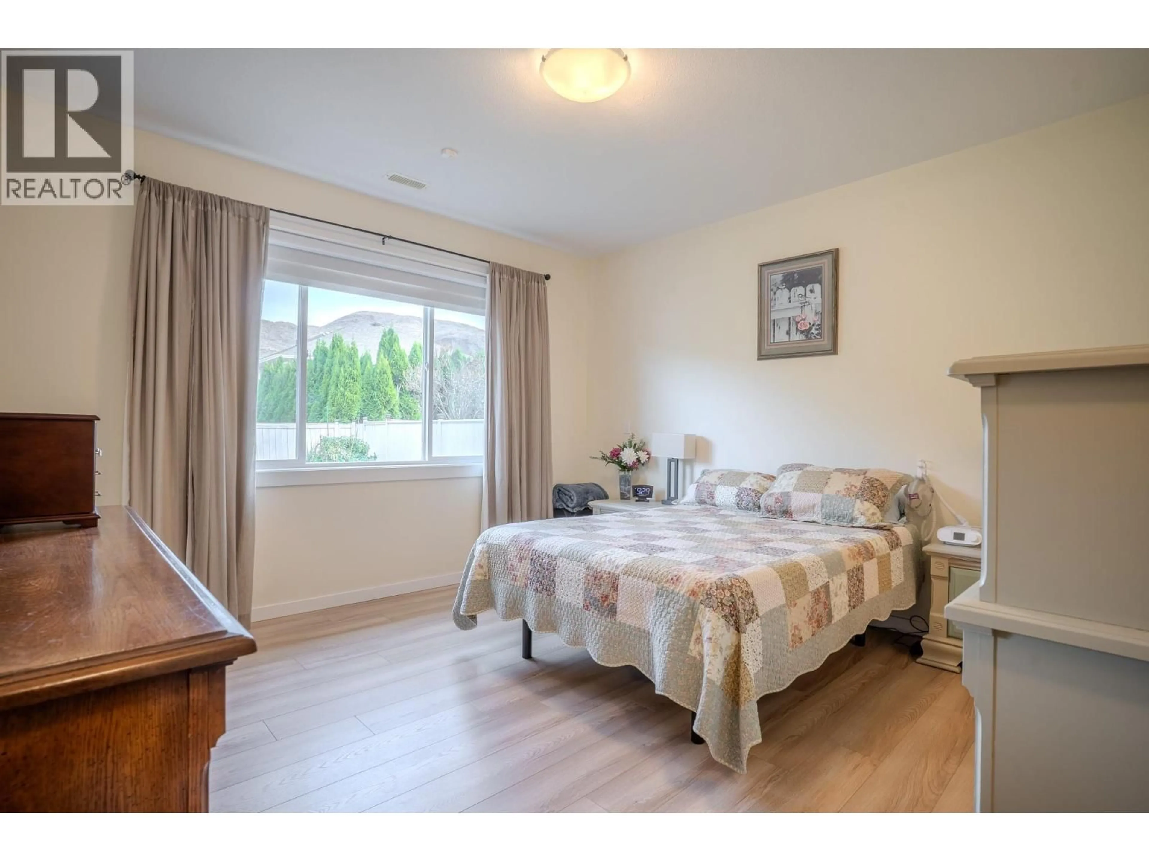 Bedroom with bed, wood/laminate floor for 2620 ROSEWOOD AVENUE, Kamloops British Columbia V2B0C4