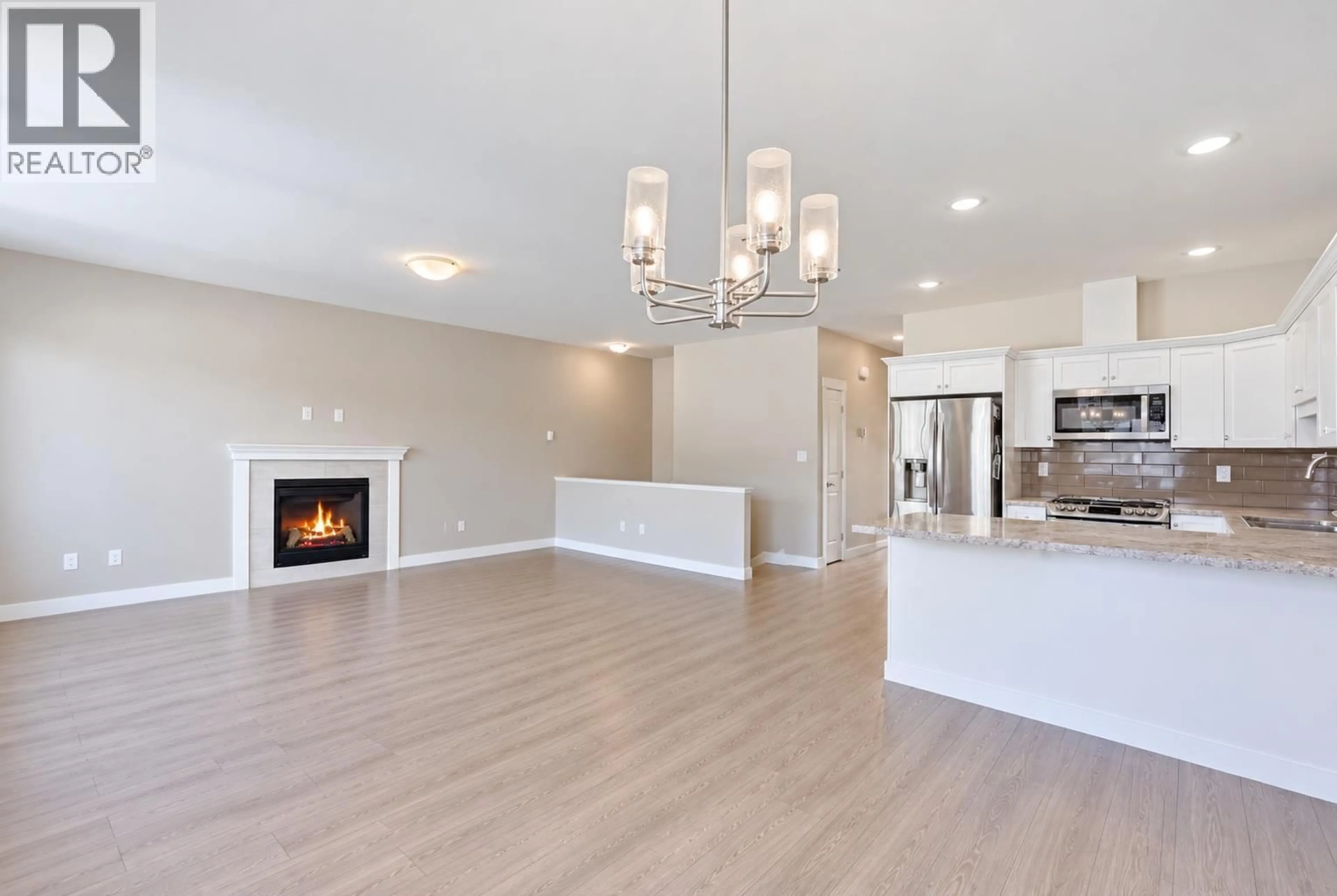 Open concept kitchen, wood/laminate floor for 2352 BOSSERT AVENUE, Kamloops British Columbia V2B4V6