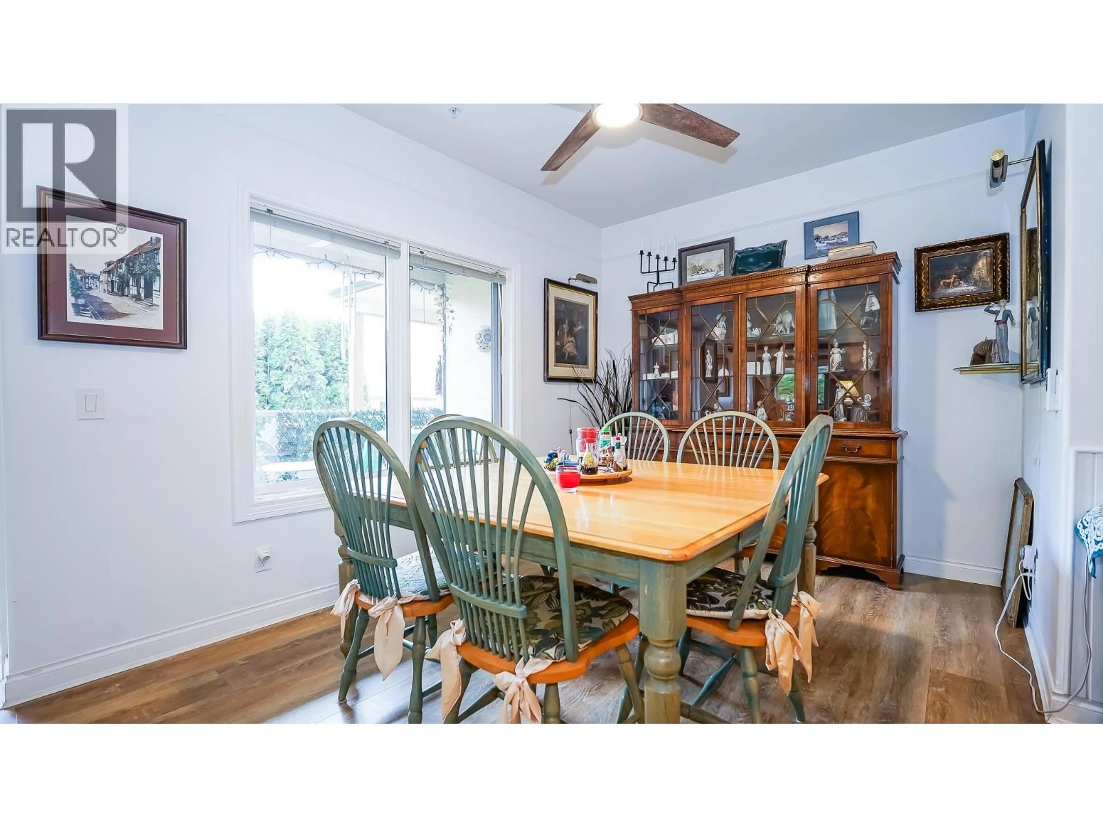 Dining room, wood/laminate floor for 104 - 1391 10 AVENUE NORTHEAST, Salmon Arm British Columbia V1E3K9