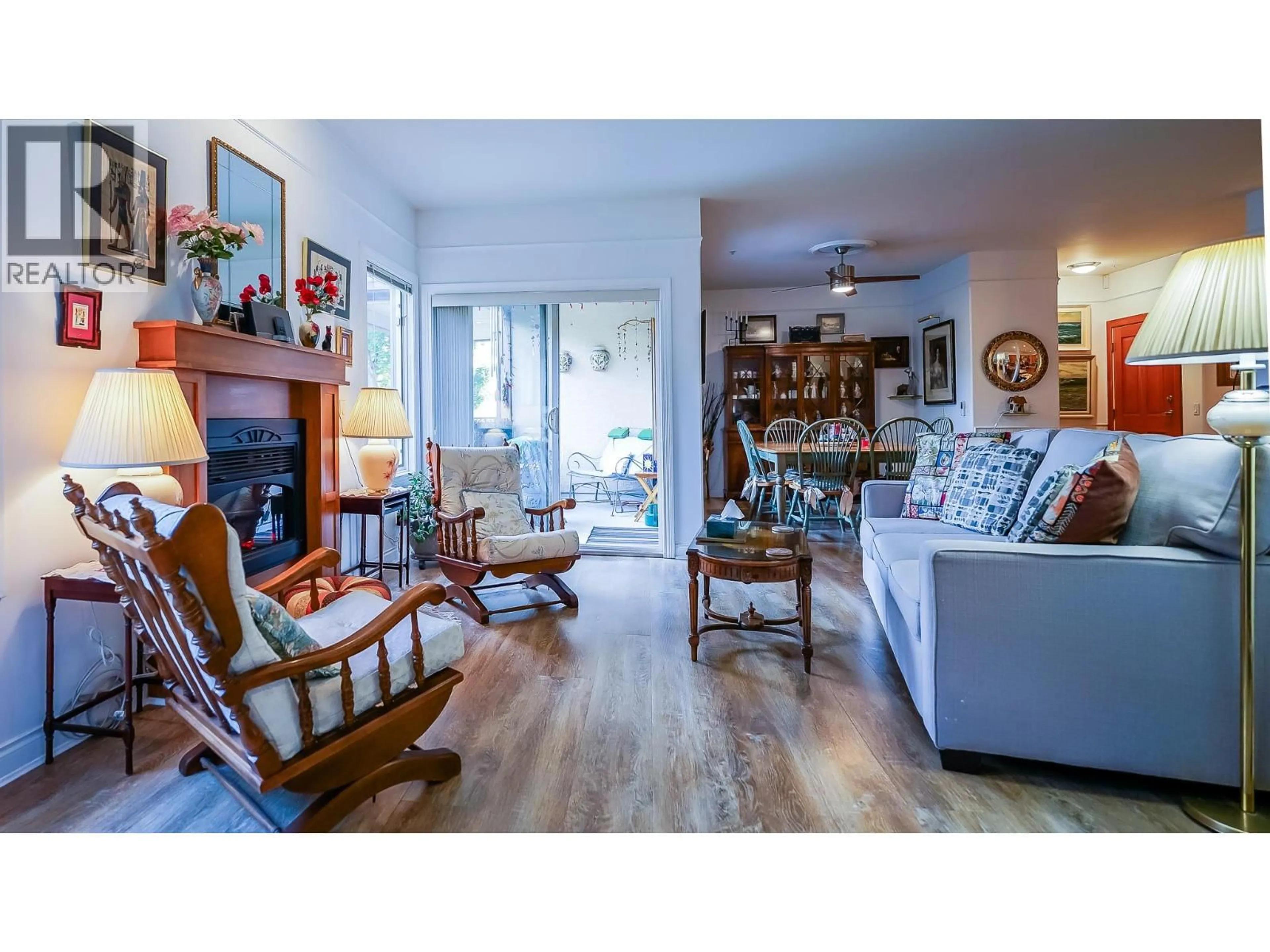 Living room with furniture, wood/laminate floor for 104 - 1391 10 AVENUE NORTHEAST, Salmon Arm British Columbia V1E3K9