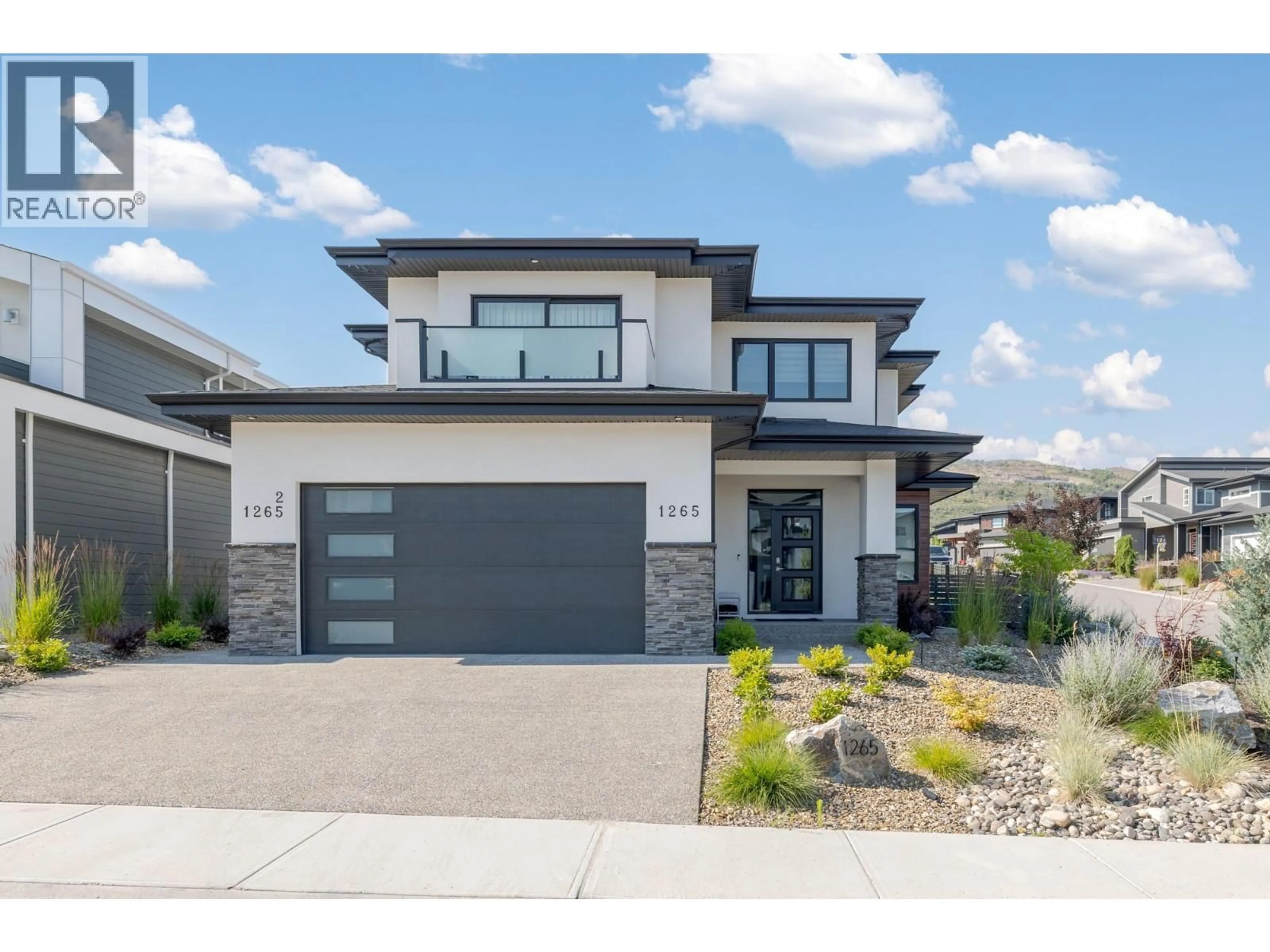Home with brick exterior material, street for 1265 PONDS AVENUE, Kelowna British Columbia V1W5N1