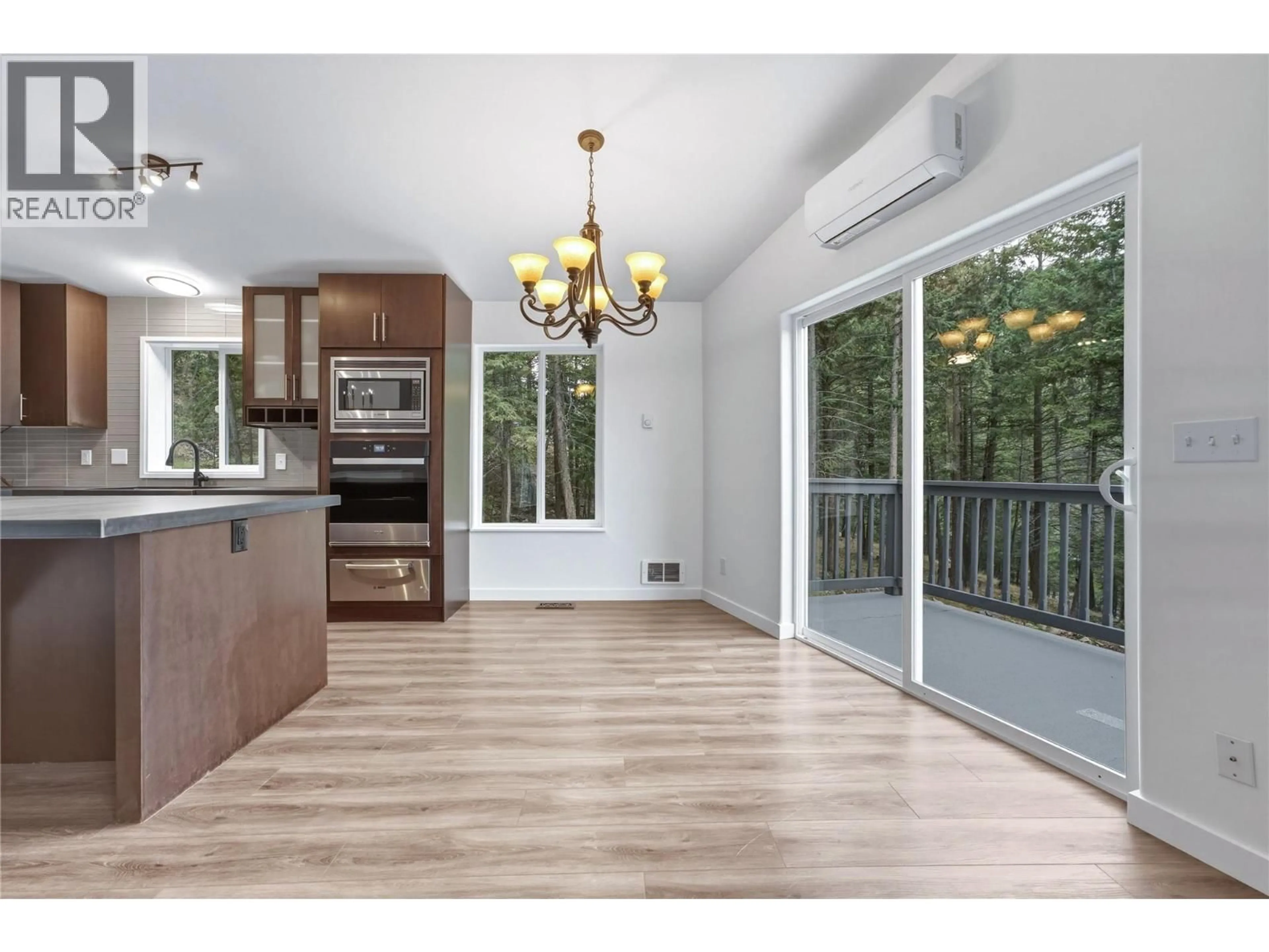 Open concept kitchen, wood/laminate floor for 10824 WESTSHORE ROAD, Vernon British Columbia V1H2C3