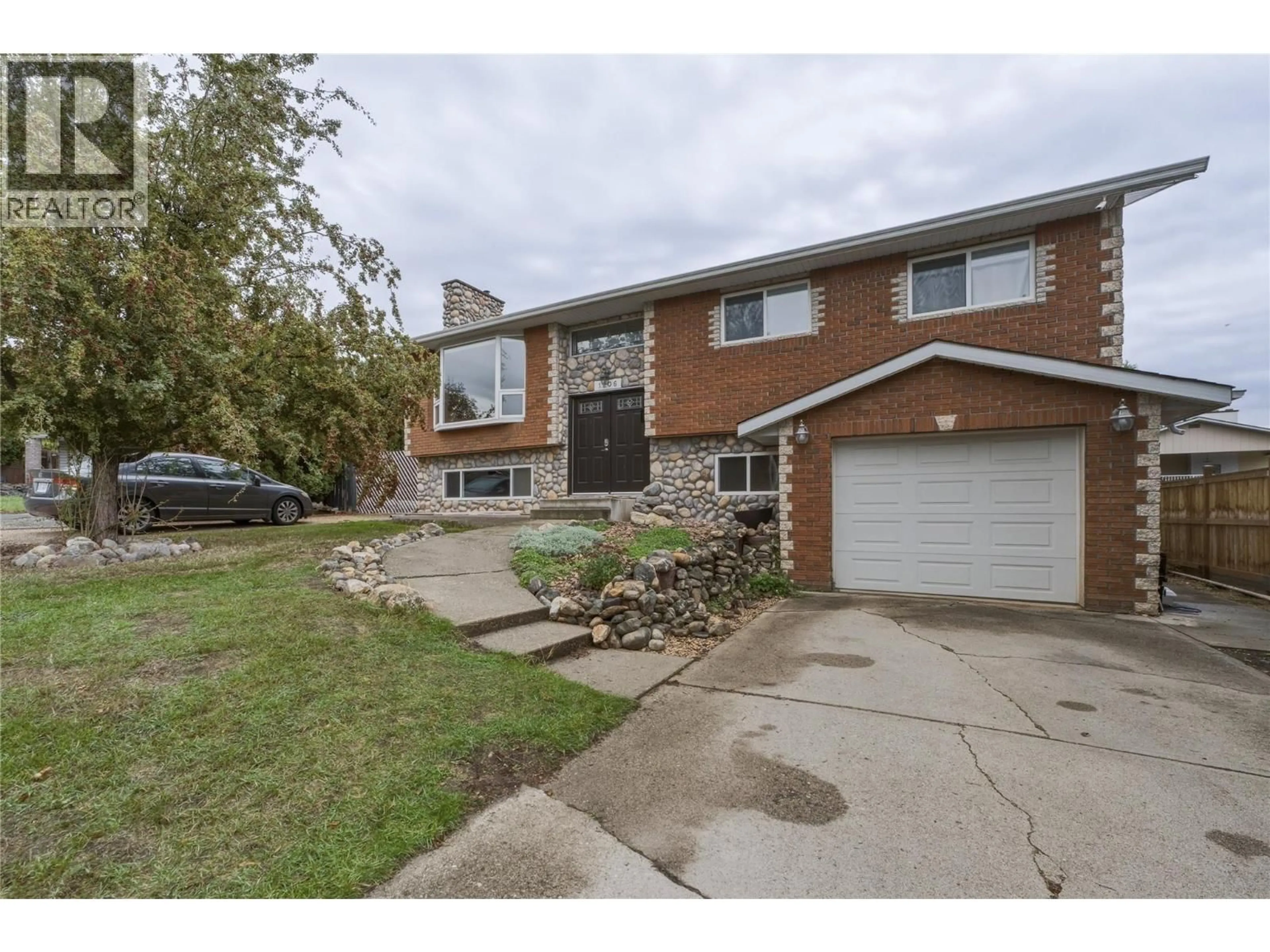 Home with brick exterior material, street for 1206 39B AVENUE, Vernon British Columbia V1T7K4