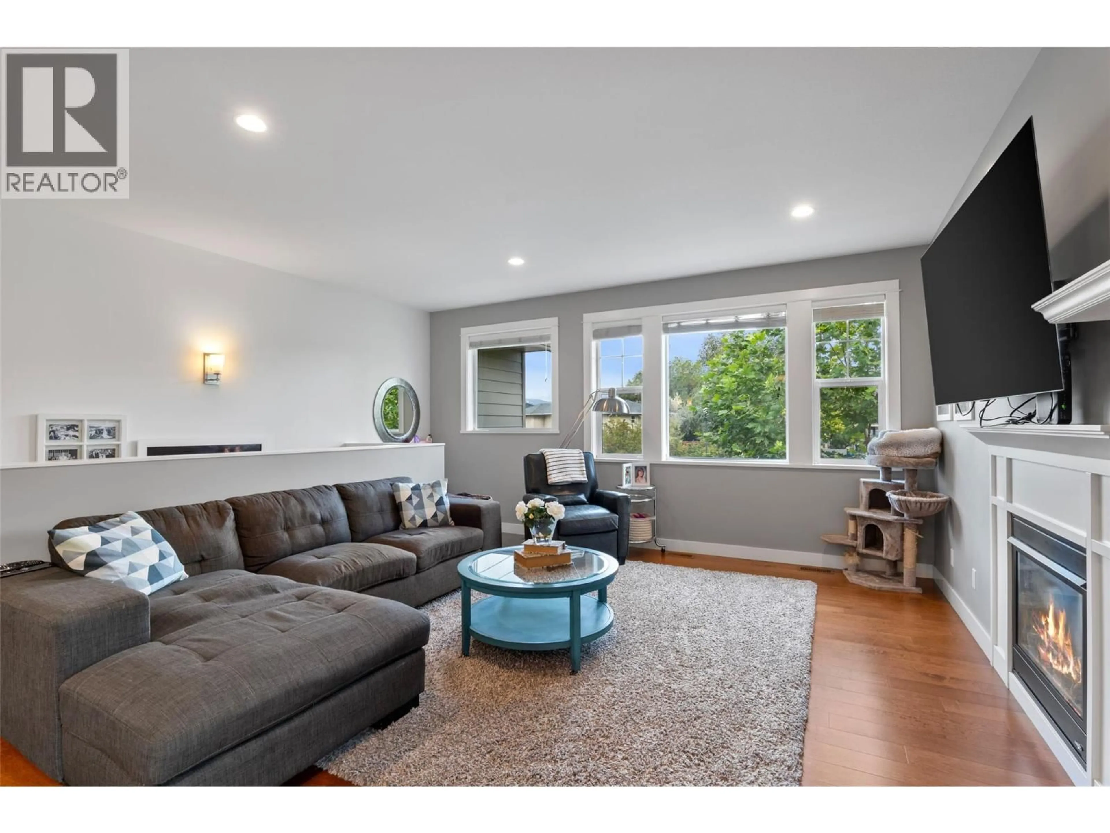 Living room with furniture, wood/laminate floor for 158 FERNIE PLACE, Kamloops British Columbia V2C6S4