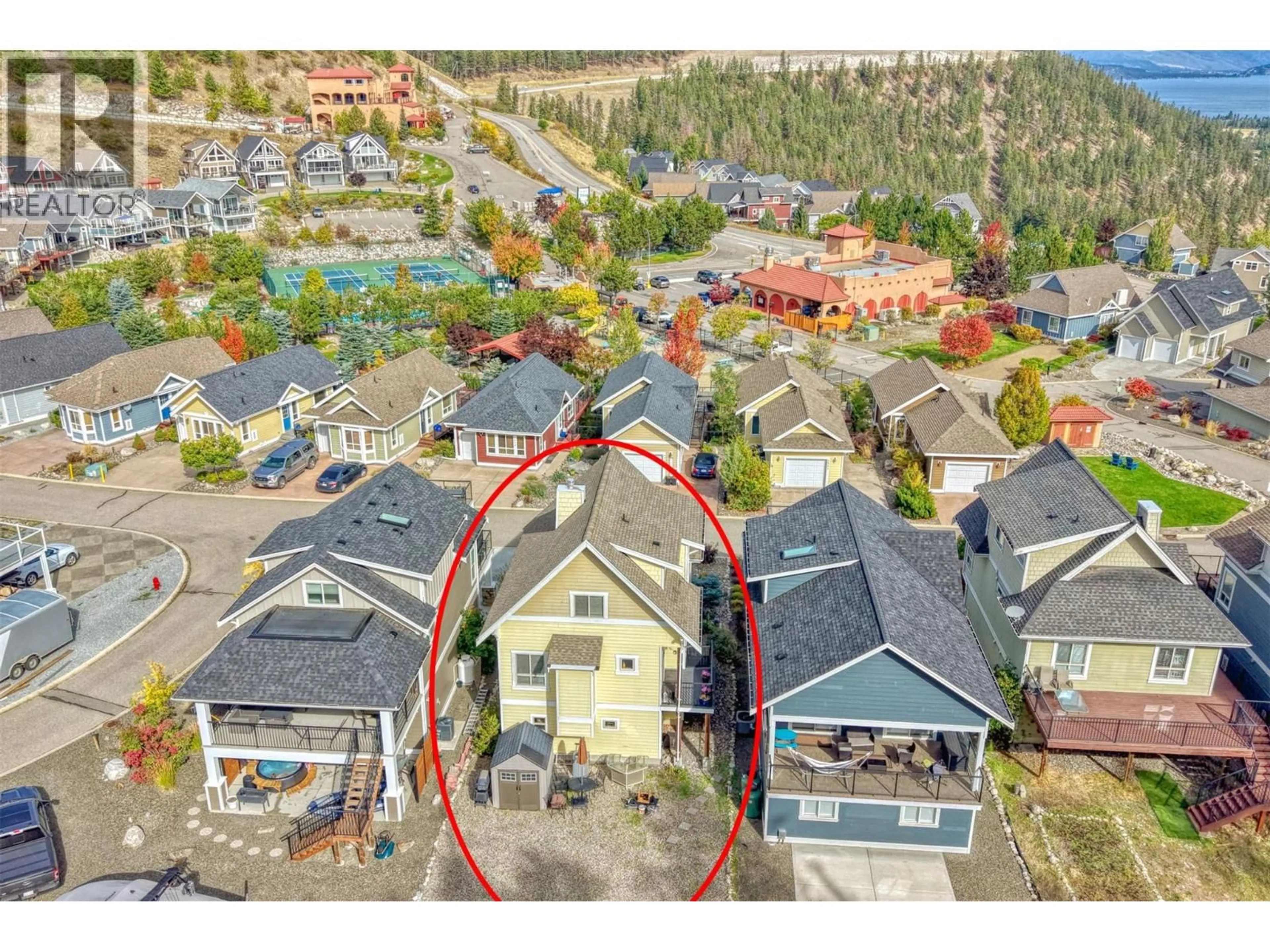 A pic from outside/outdoor area/front of a property/back of a property/a pic from drone, street for 310 - 6822 MADRID WAY, Kelowna British Columbia V1Z3R8