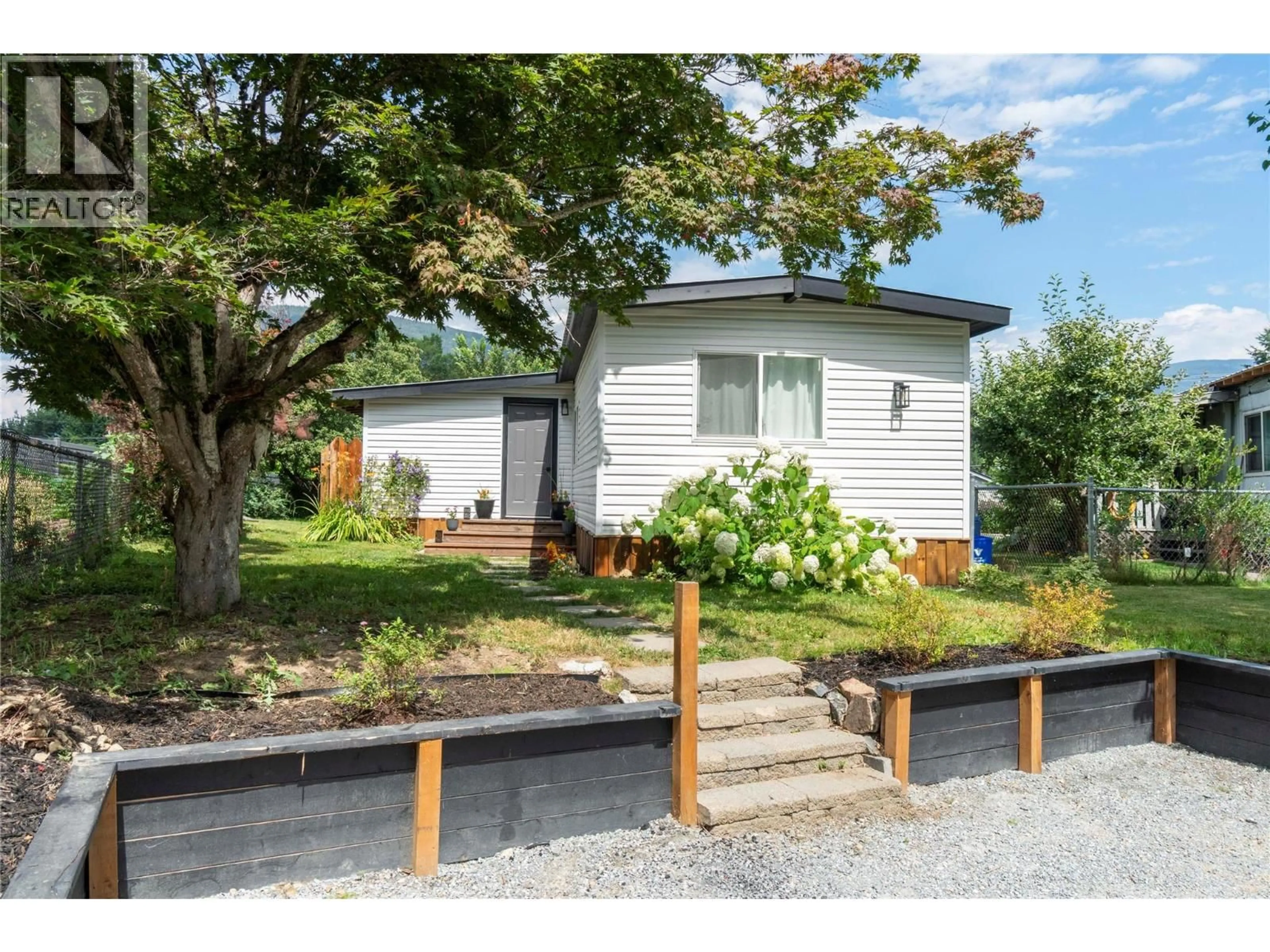 Home with vinyl exterior material, street for 5131 69 AVENUE NORTHEAST, Salmon Arm British Columbia V0E1K0